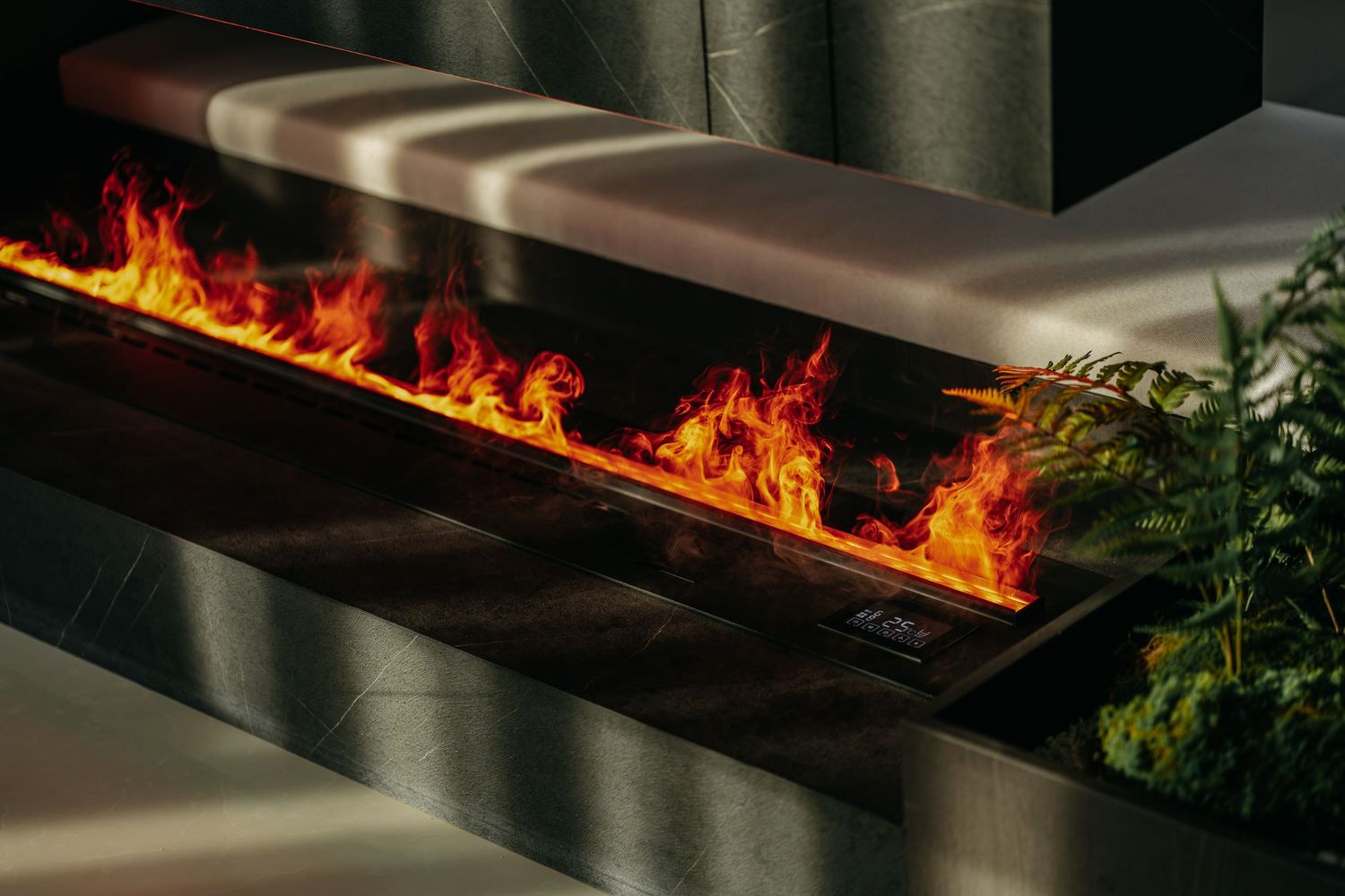 Modern fireplace with realistic flame effect built into a sleek bench design.