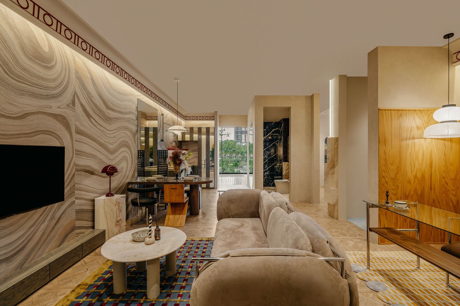 Contemporary living room with wavy wall design, neutral furnishings and wooden accents.
