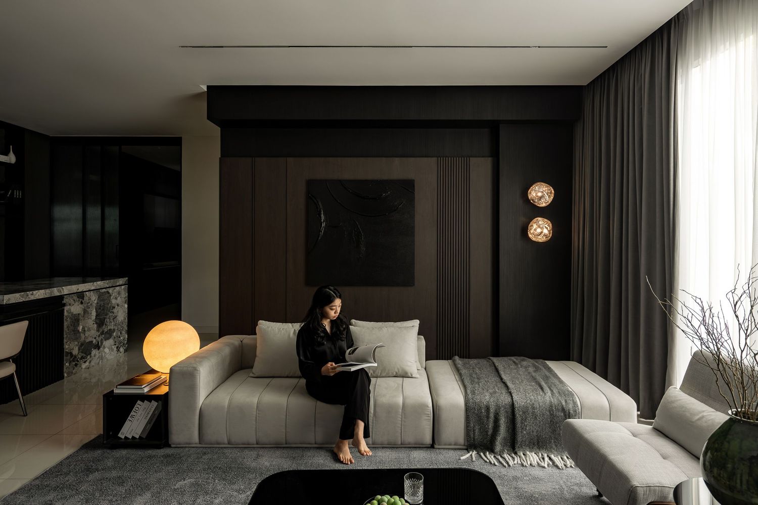 Modern dark bedroom interior with spherical lights and floor-to-ceiling windows creating a moody atmosphere.