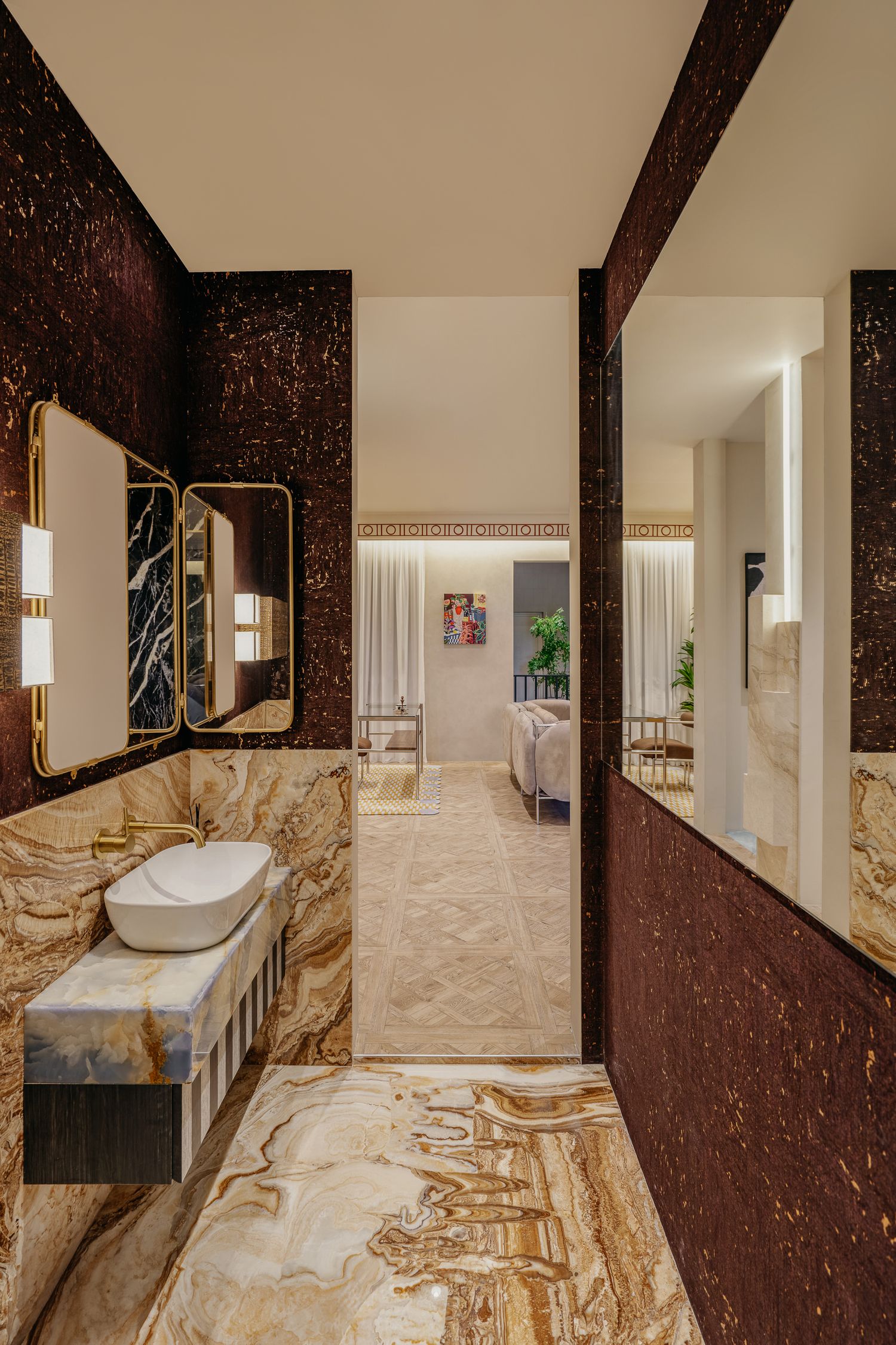 Elegant marble bathroom interior with modern fixtures and dramatic dark accent walls.