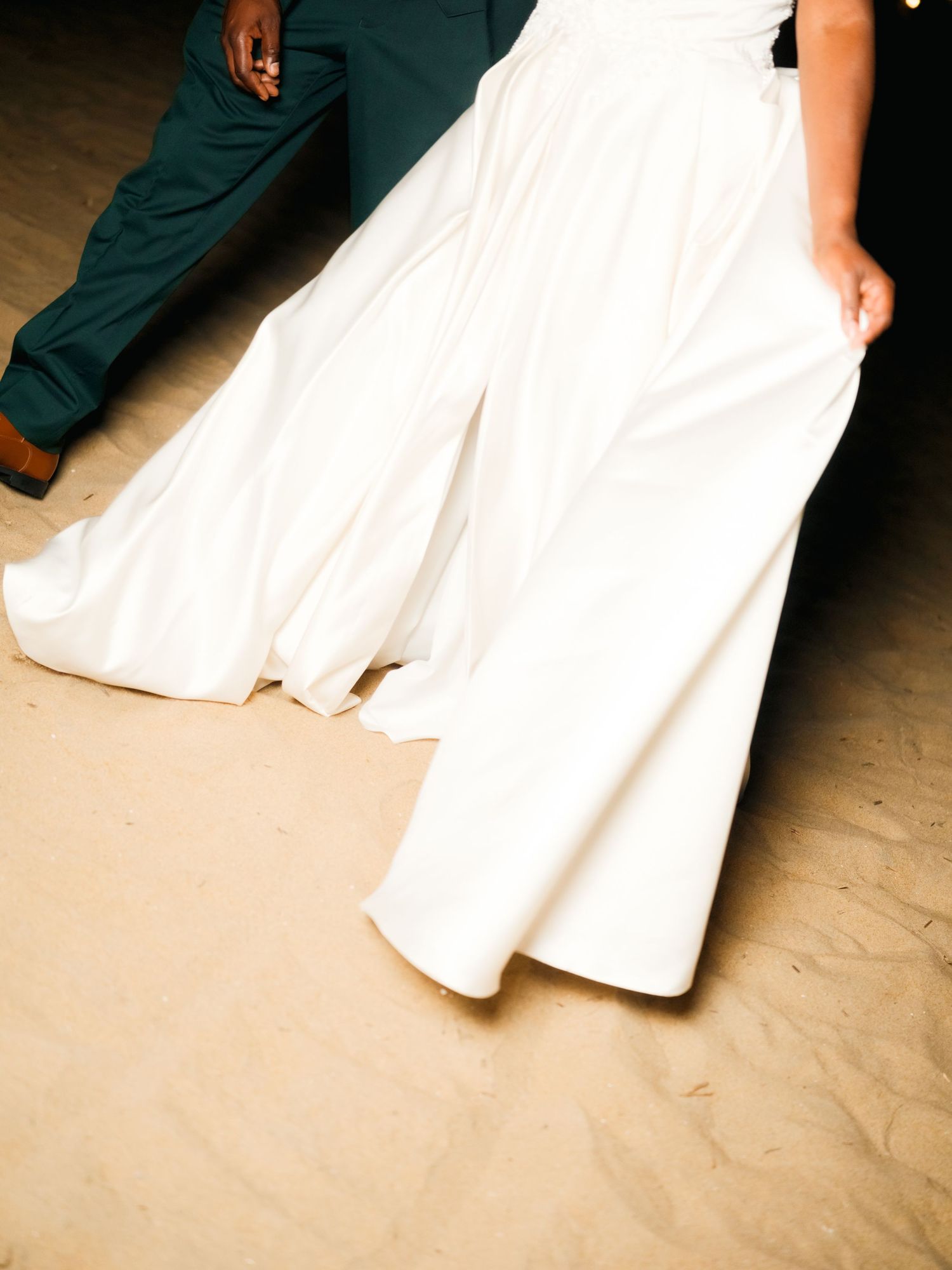 A couple in formal wedding attire dance together, with the bride's white dress flowing gracefully across multiple frames.