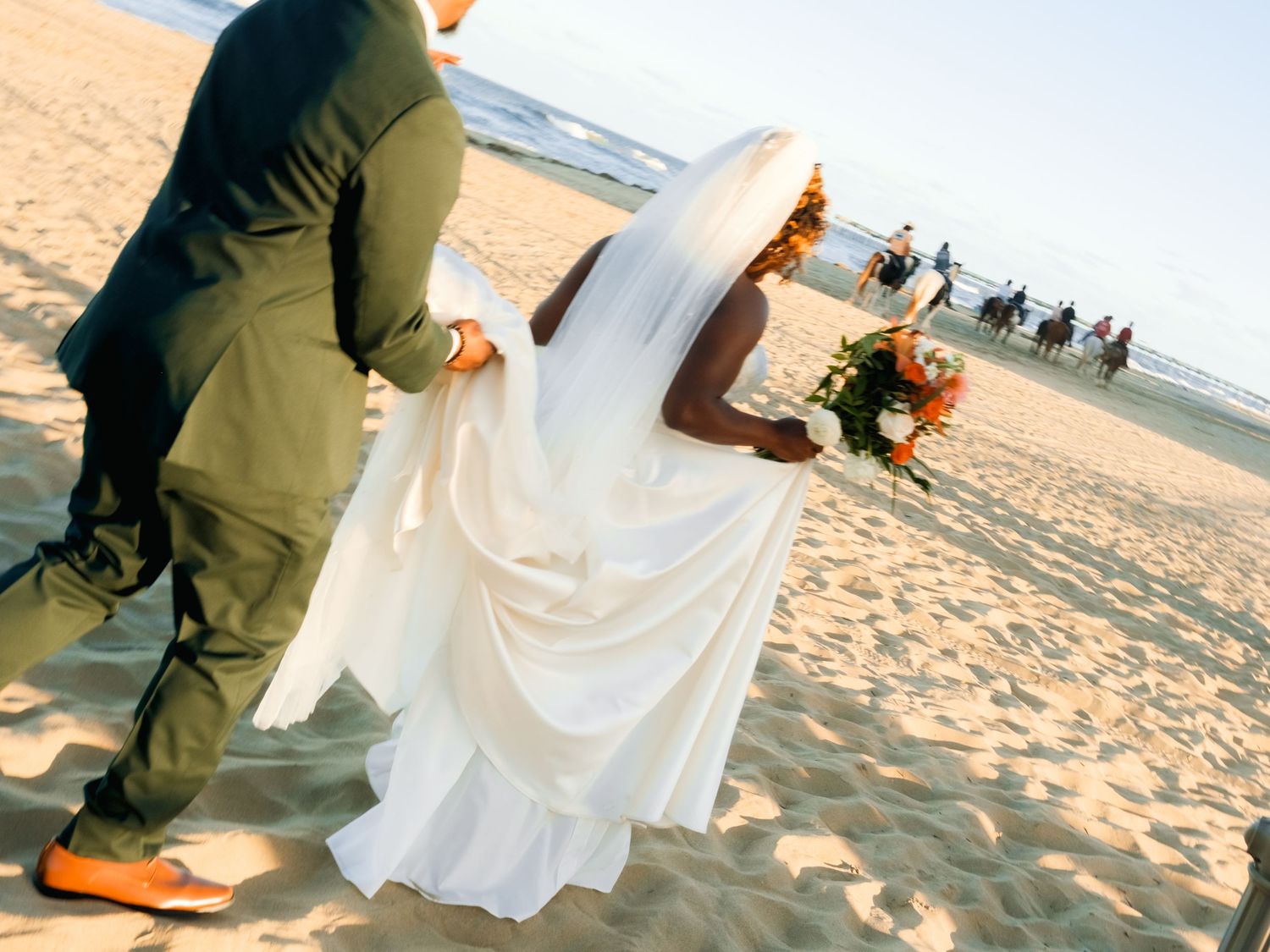 Beach wedding photography sequence with flowing white dress against sand and ocean backdrop.