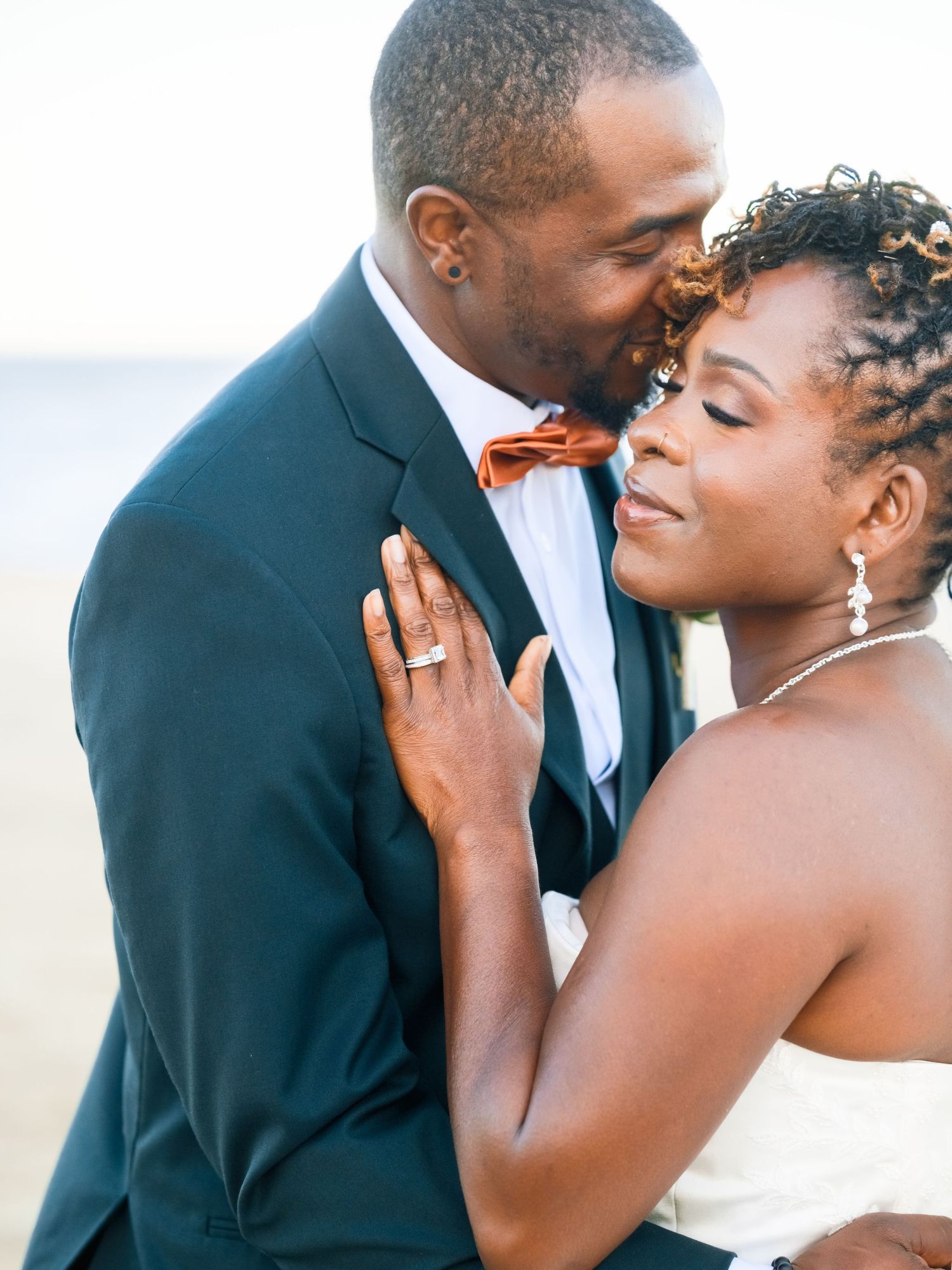 A romantic wedding photoshoot sequence showing tender moments between a couple in formal attire.