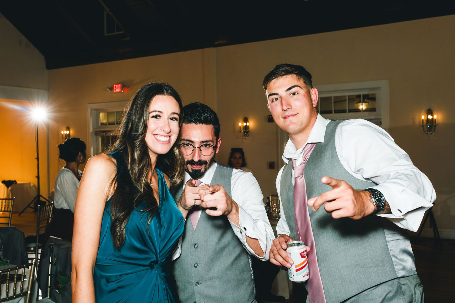 A horizontal collage of party photos showing people celebrating and socializing at an indoor event.