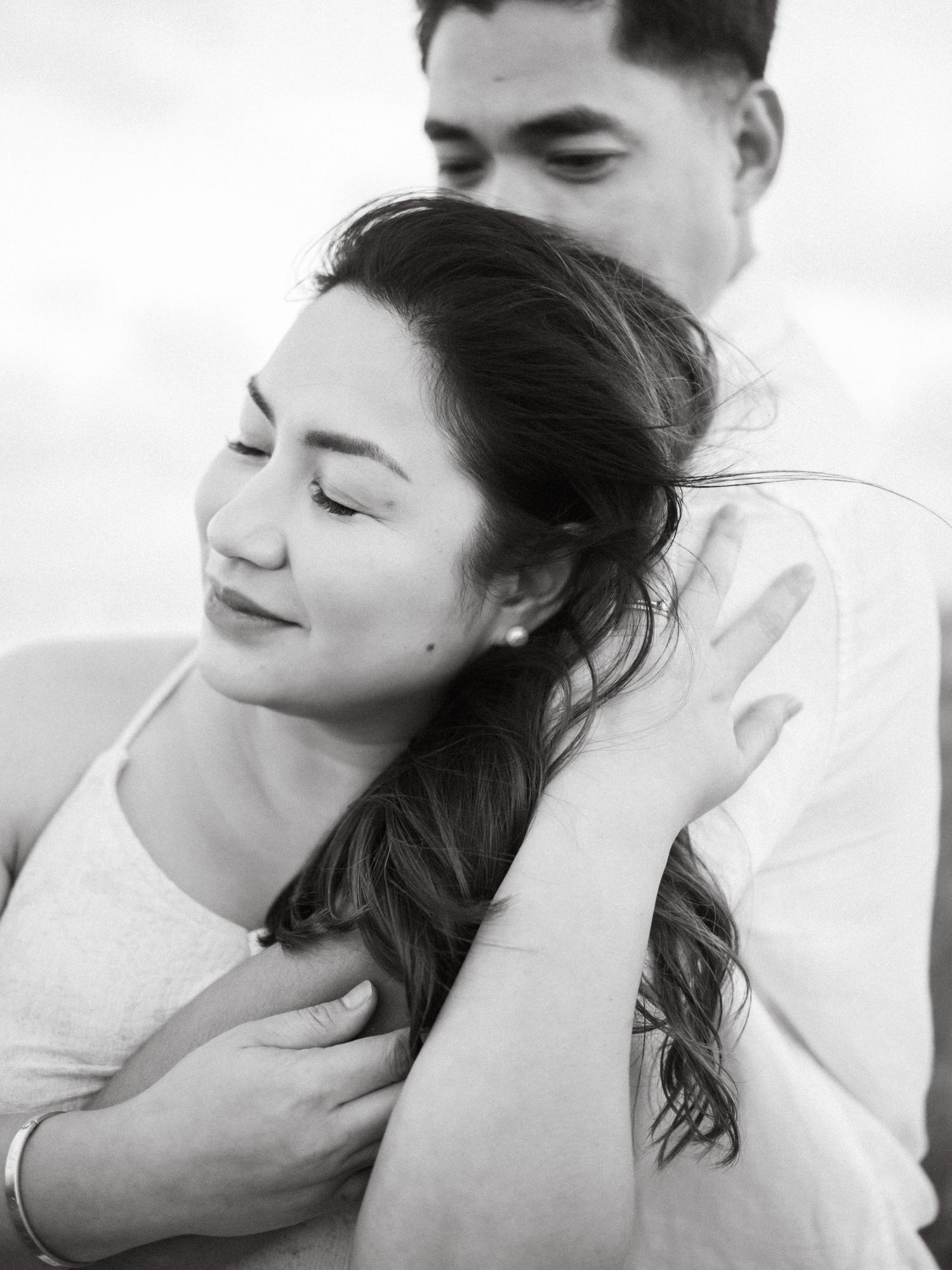 A serene black and white photo series depicting intimate moments of tenderness and gentle affection.