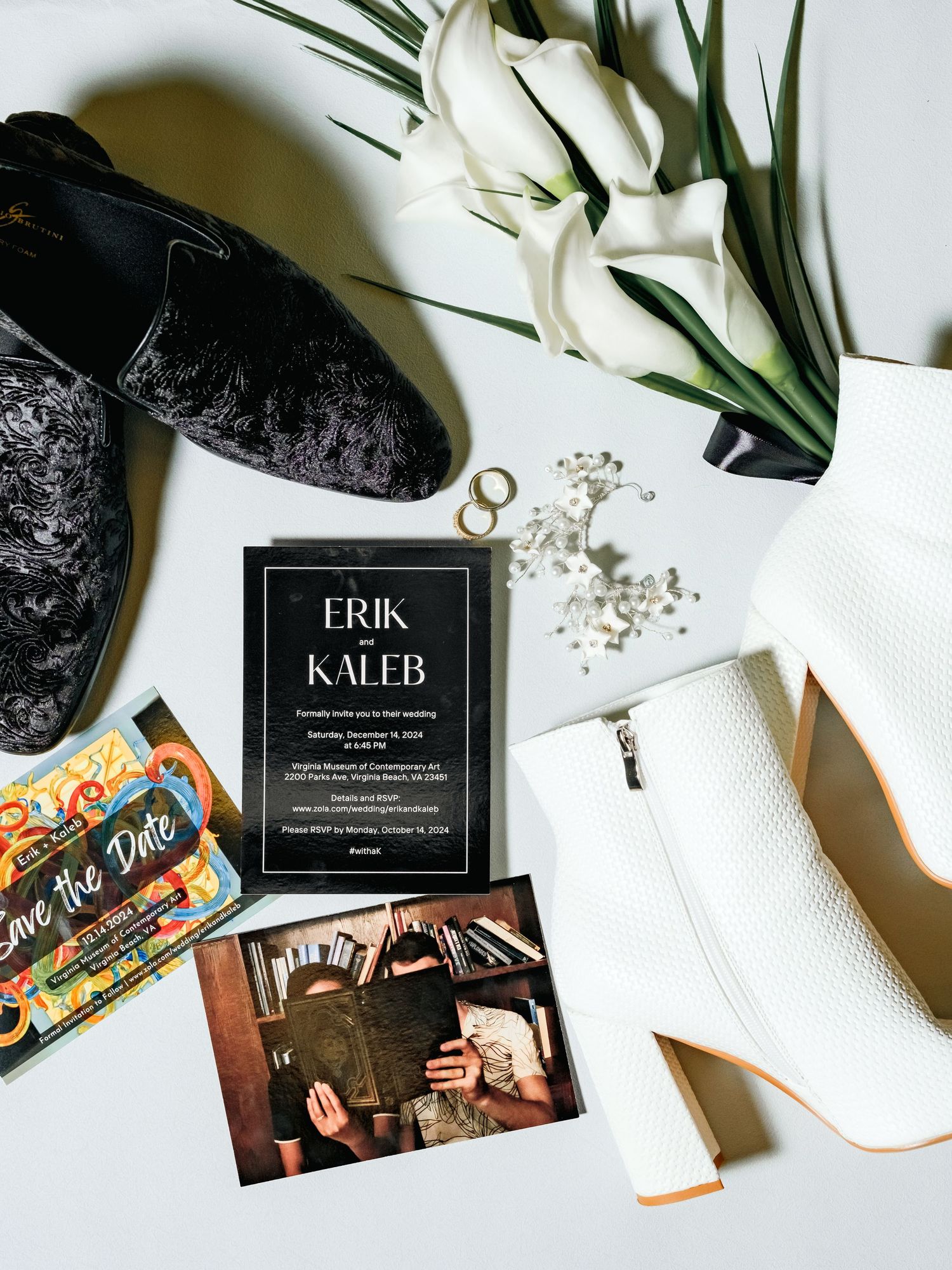 White flat lay photography with black business cards, gentle shadows and scattered small crystals or beads.
