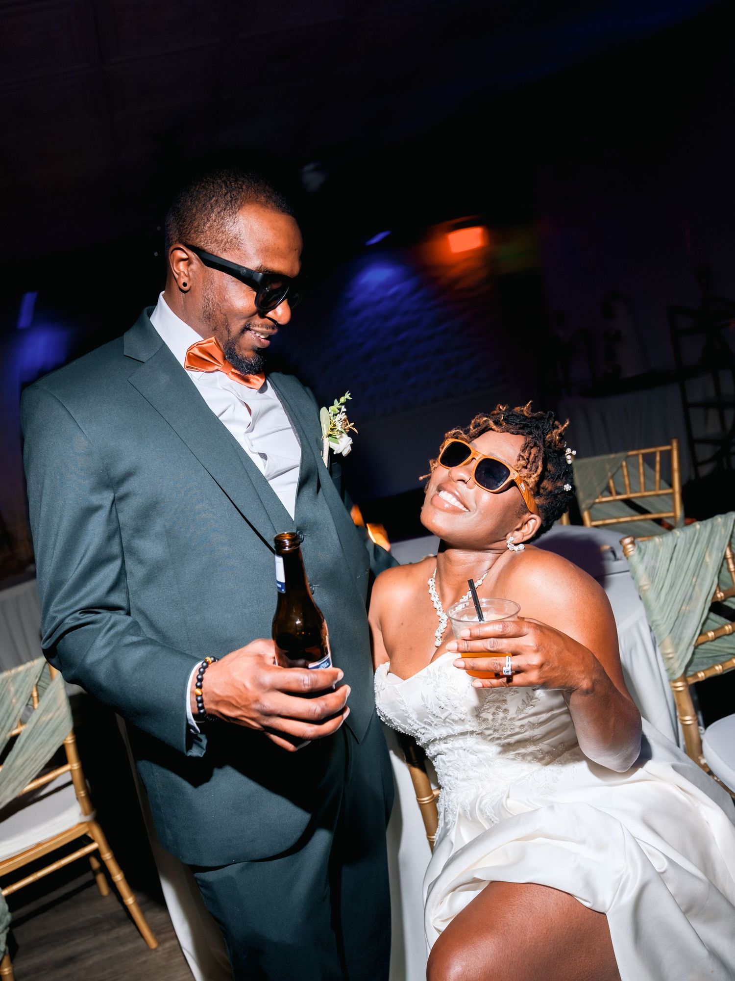 Reception celebration photos showing couple enjoying drinks and laughter together.