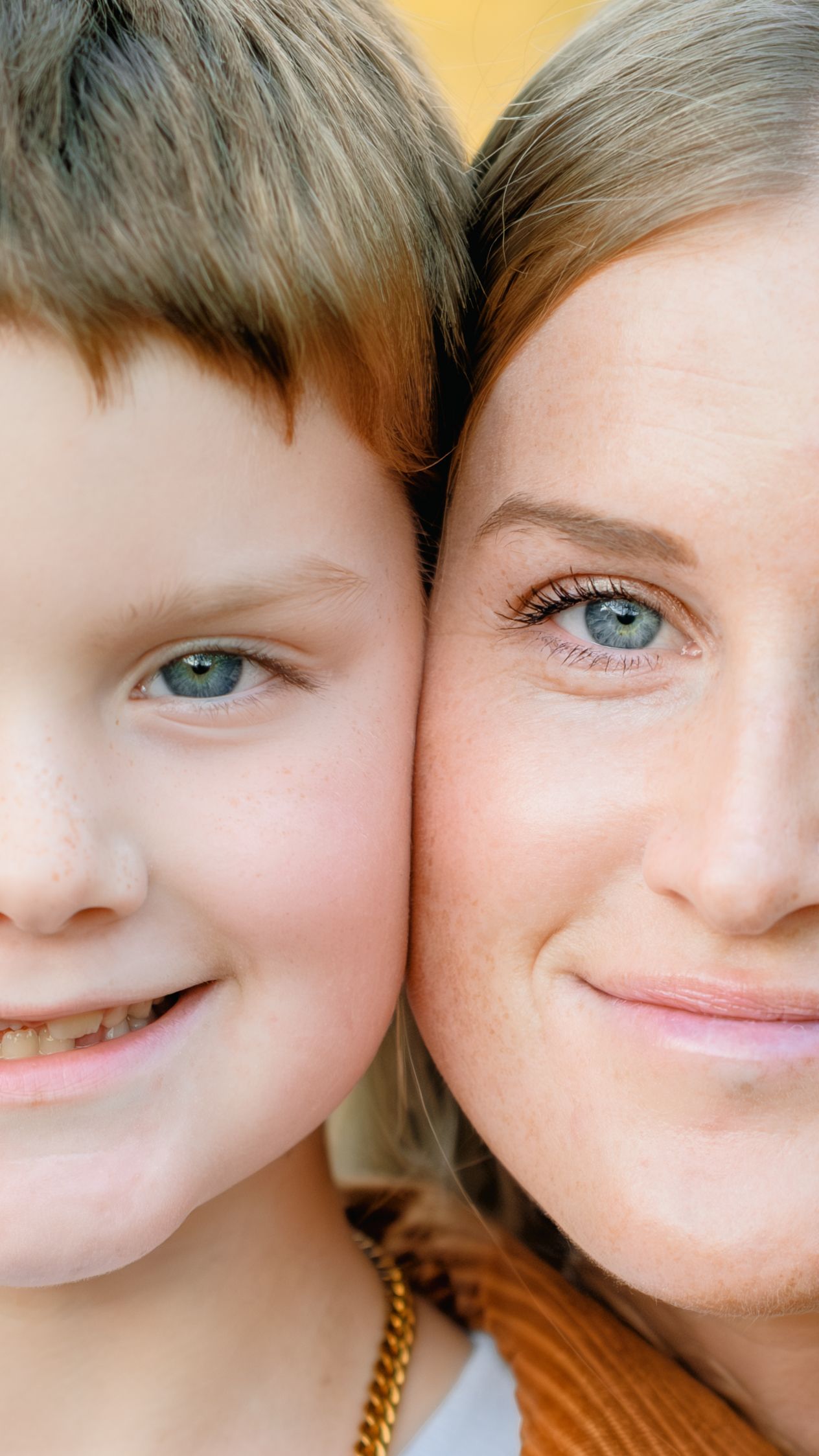 A series of cropped close-up portraits showing bright blue eyes and smiling expressions against a yellow background.