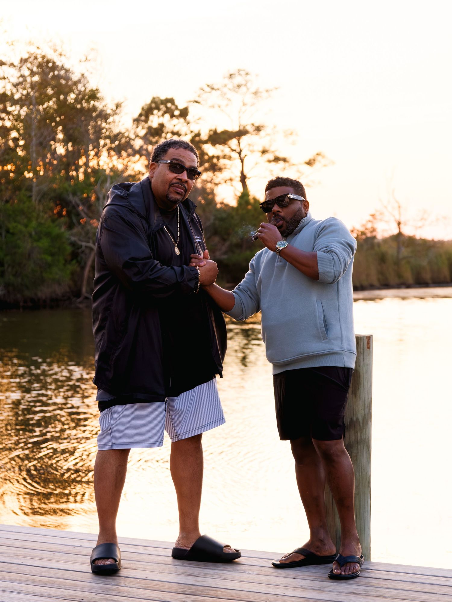 Two people in casual wear sitting on a wooden dock during sunset, a sequence showing the progression of a proposal.