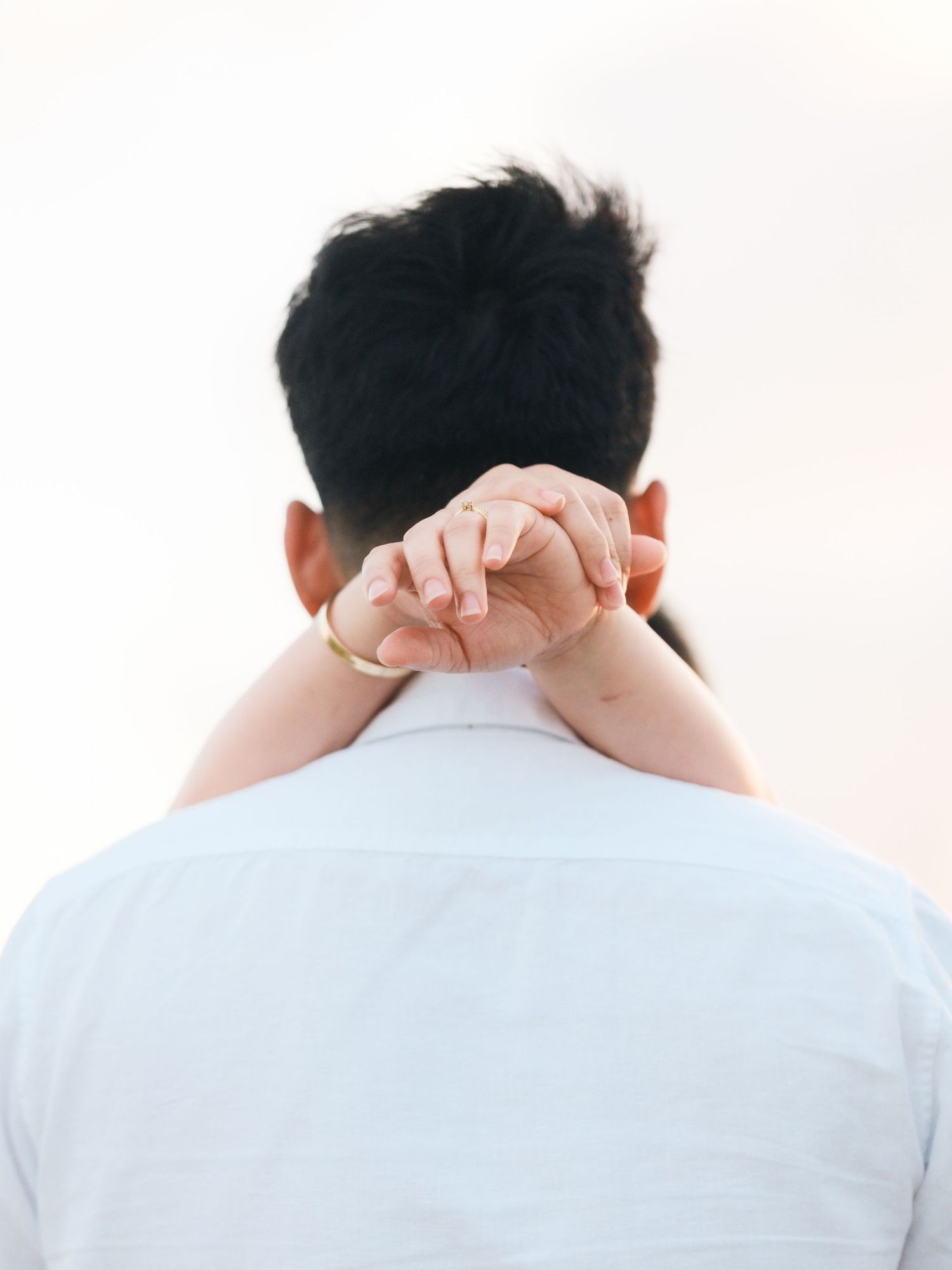 Series of close-up shots showing back of head with hands crossed behind neck.