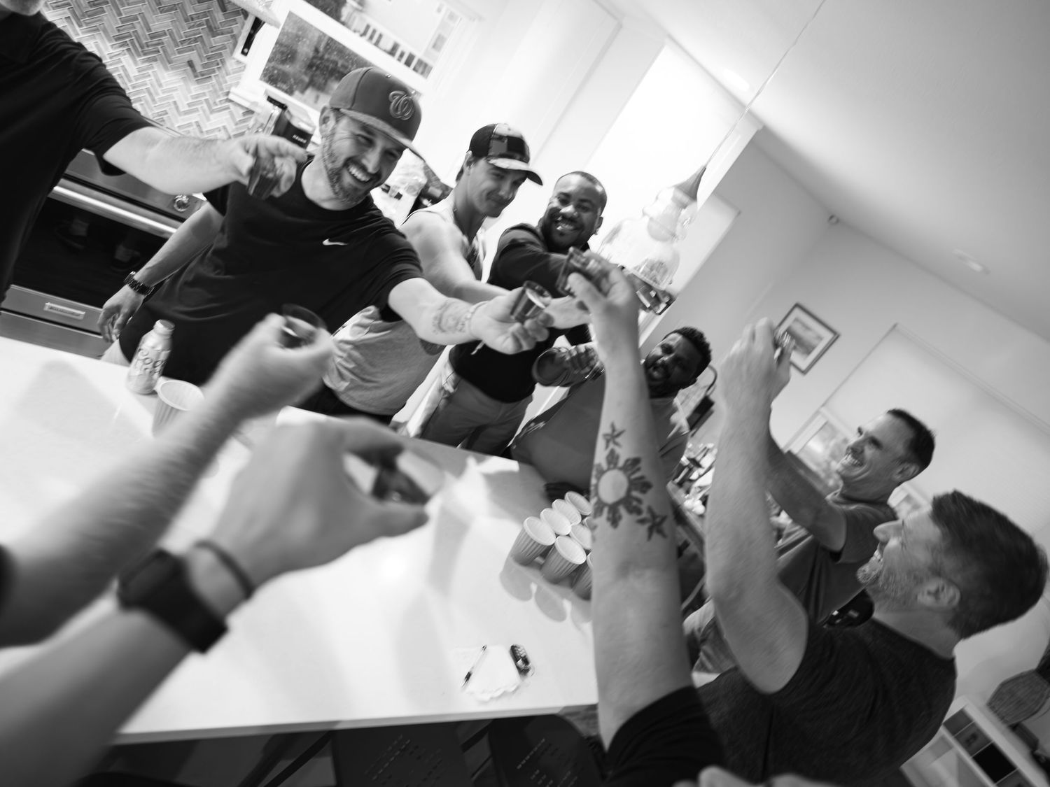 A sequence of black and white photographs showing someone taking a drink, moving from left to right.