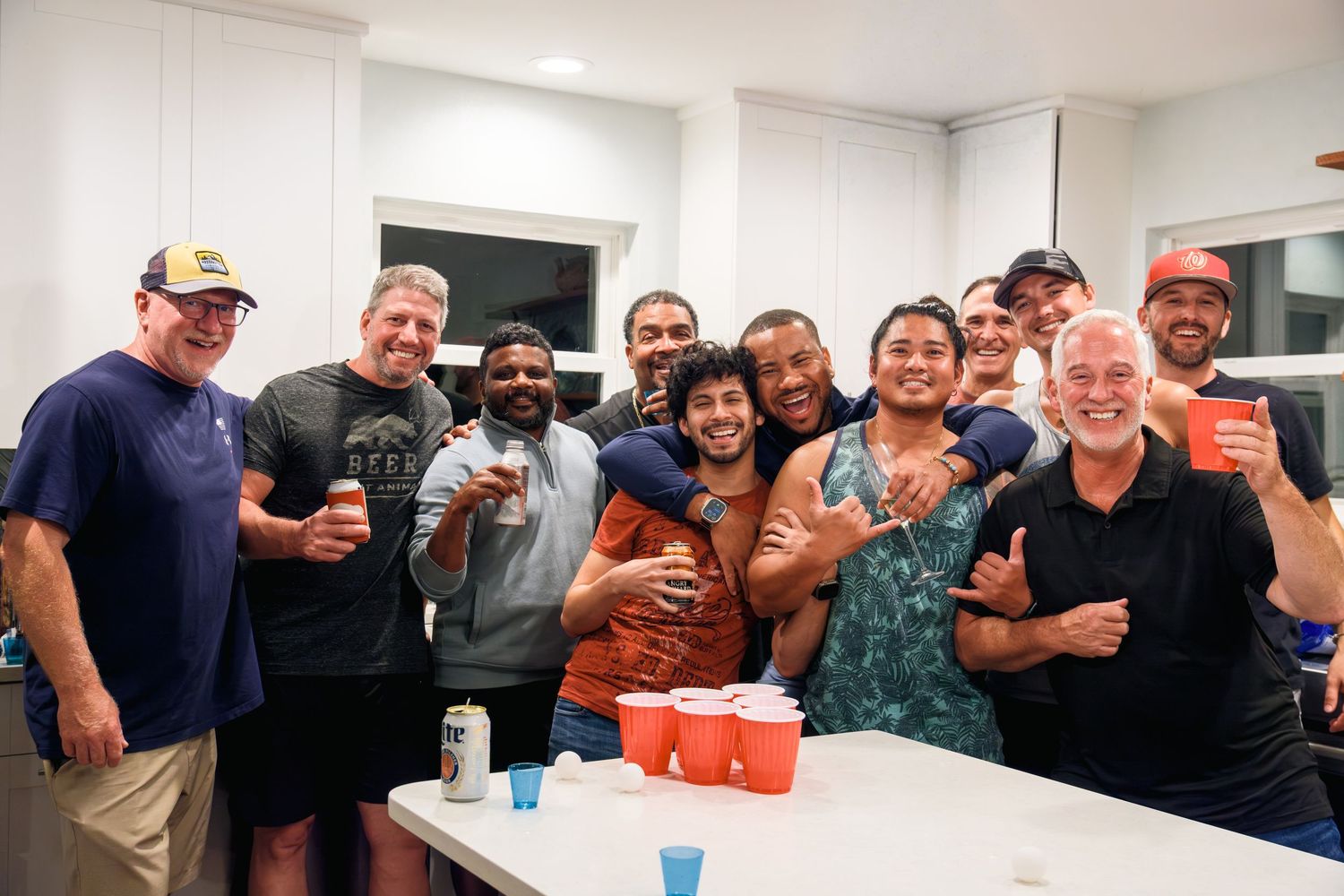 A group of teammates and coworkers posing together in a collage of casual workplace photos.