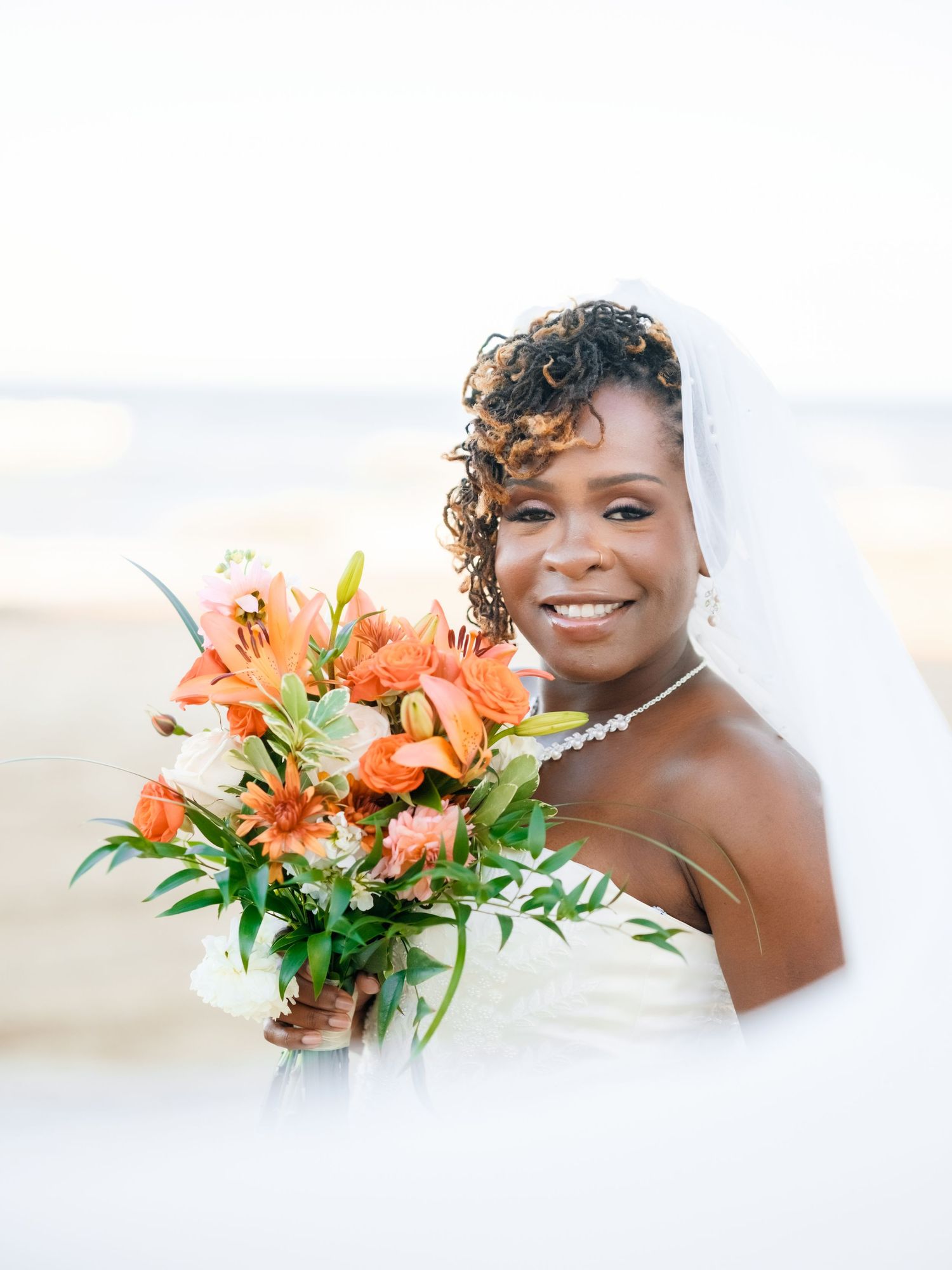 Elegant wedding photography collage featuring orange lily bouquets and bridal portraits against a light background.