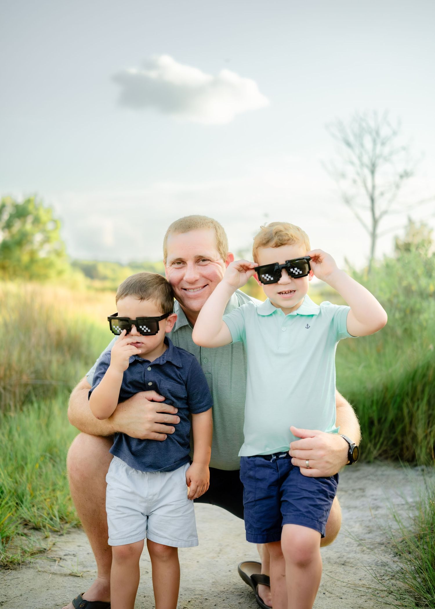 Four candid lifestyle photos of a family enjoying time together outdoors in a natural setting with sunglasses and smiles.