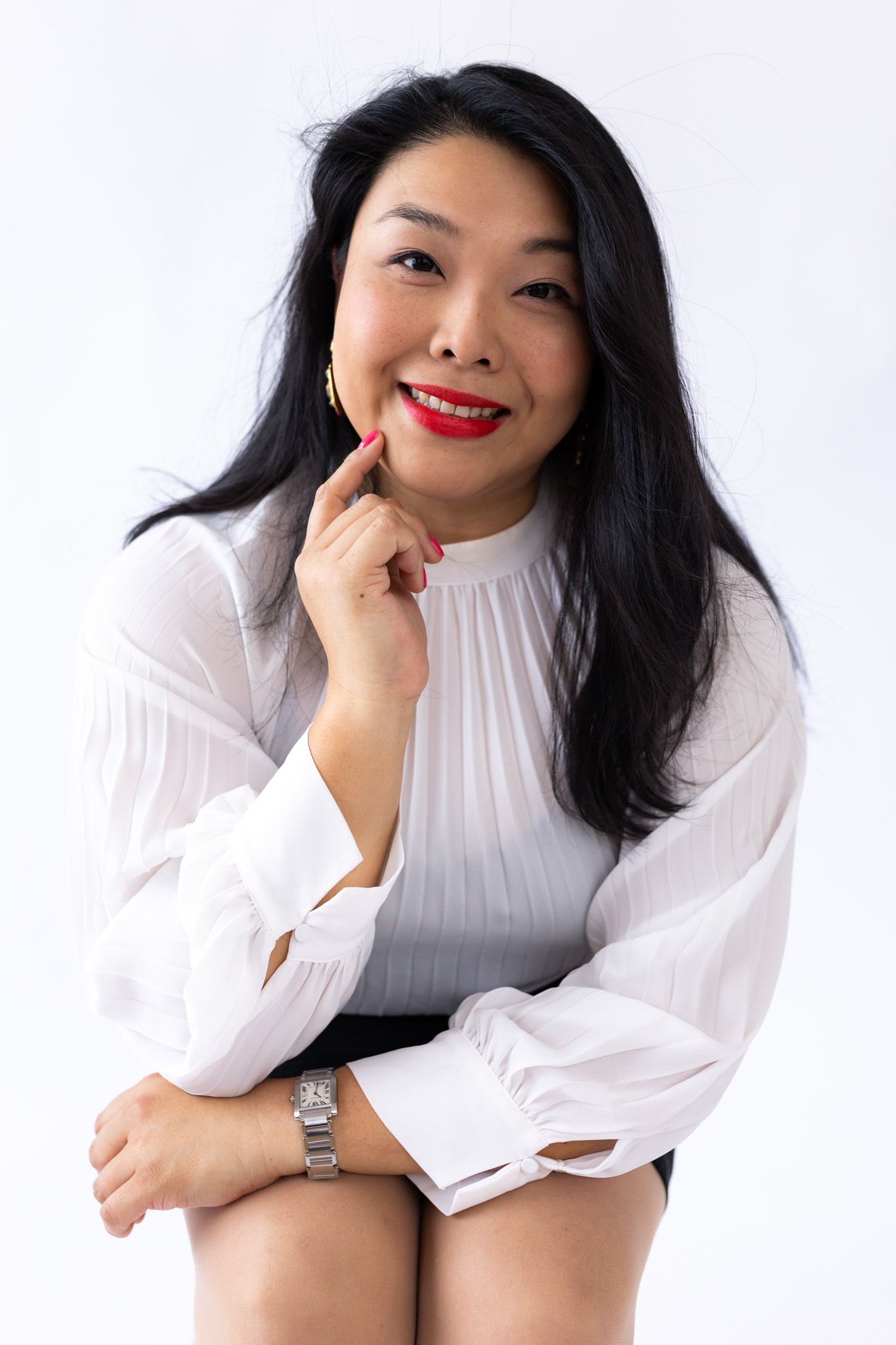 Collage of professional portrait photos featuring someone in a white turtleneck sweater against a light background.
