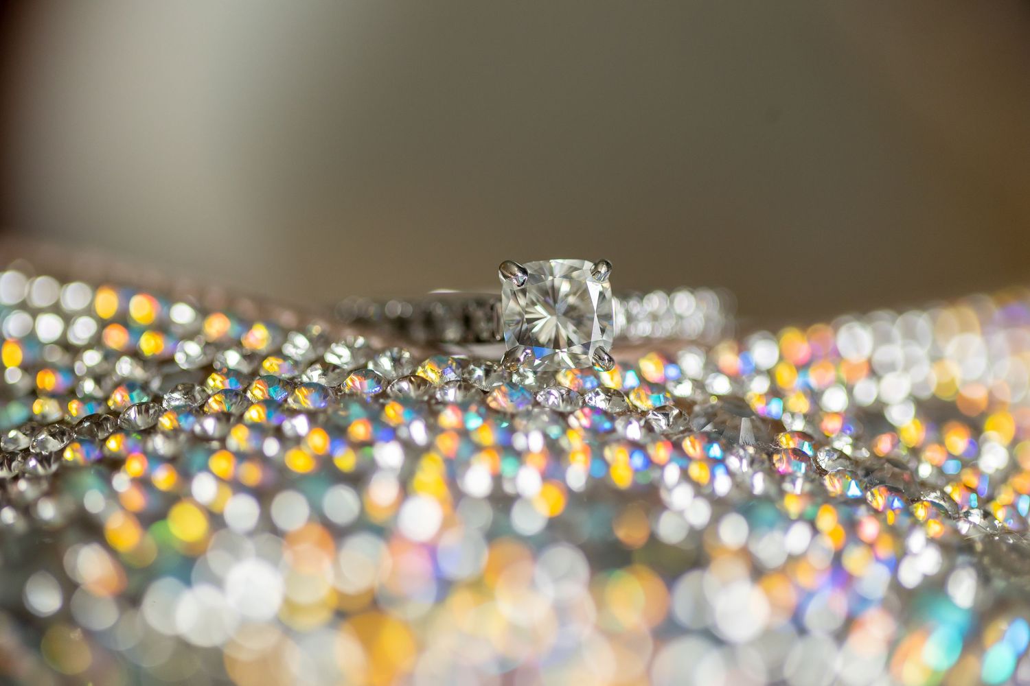 Colorful bokeh lights create a magical glittering effect against a dark background.