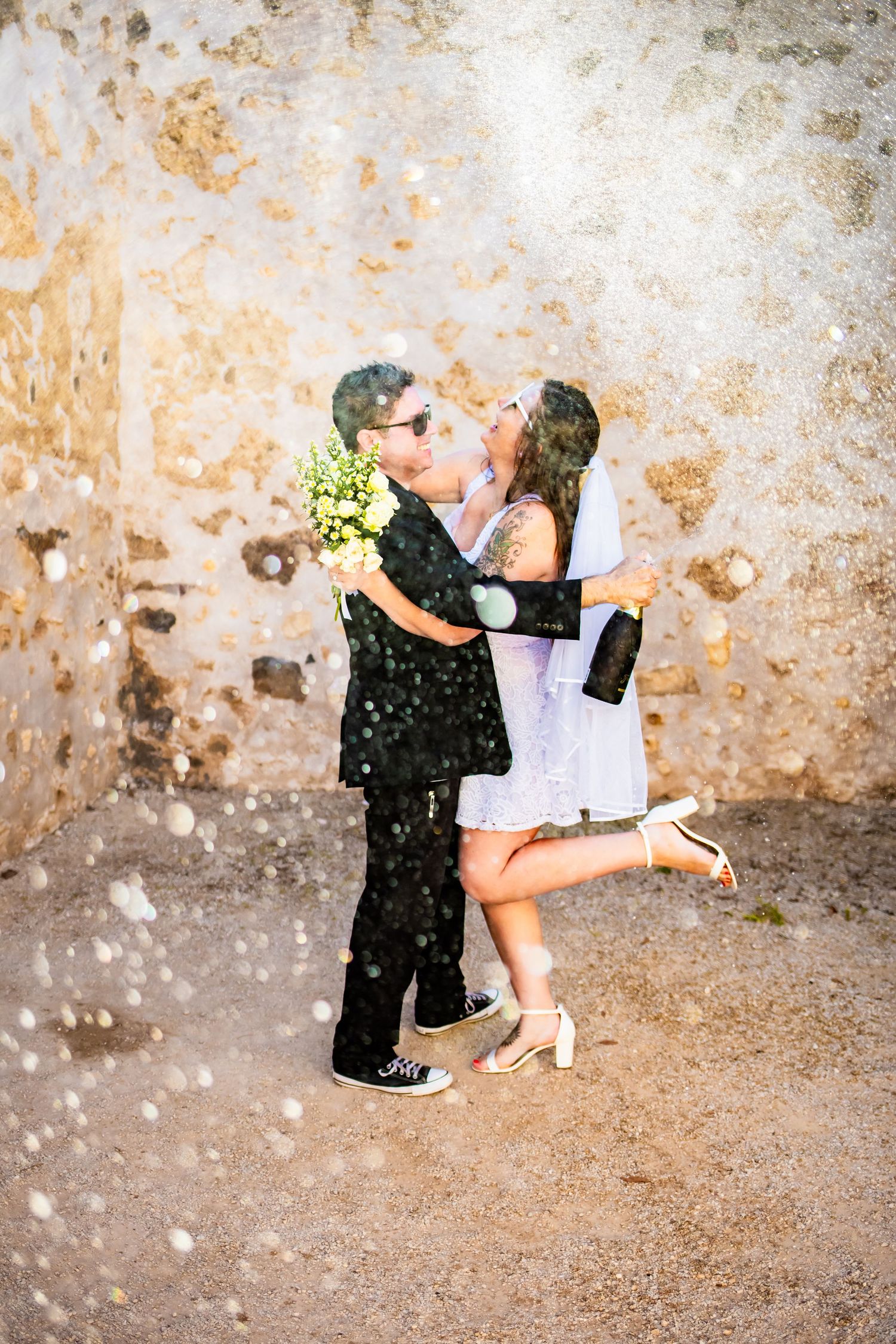 Trendy San Antonio couple posing for engagement portraits.