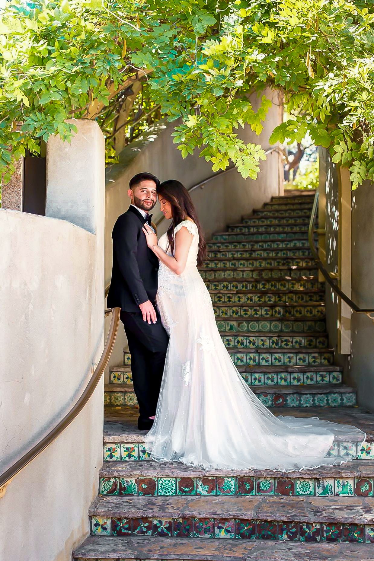 San Antonio couple posing for portraits at the Arneson River Theatre at the iconic Riverwalk.