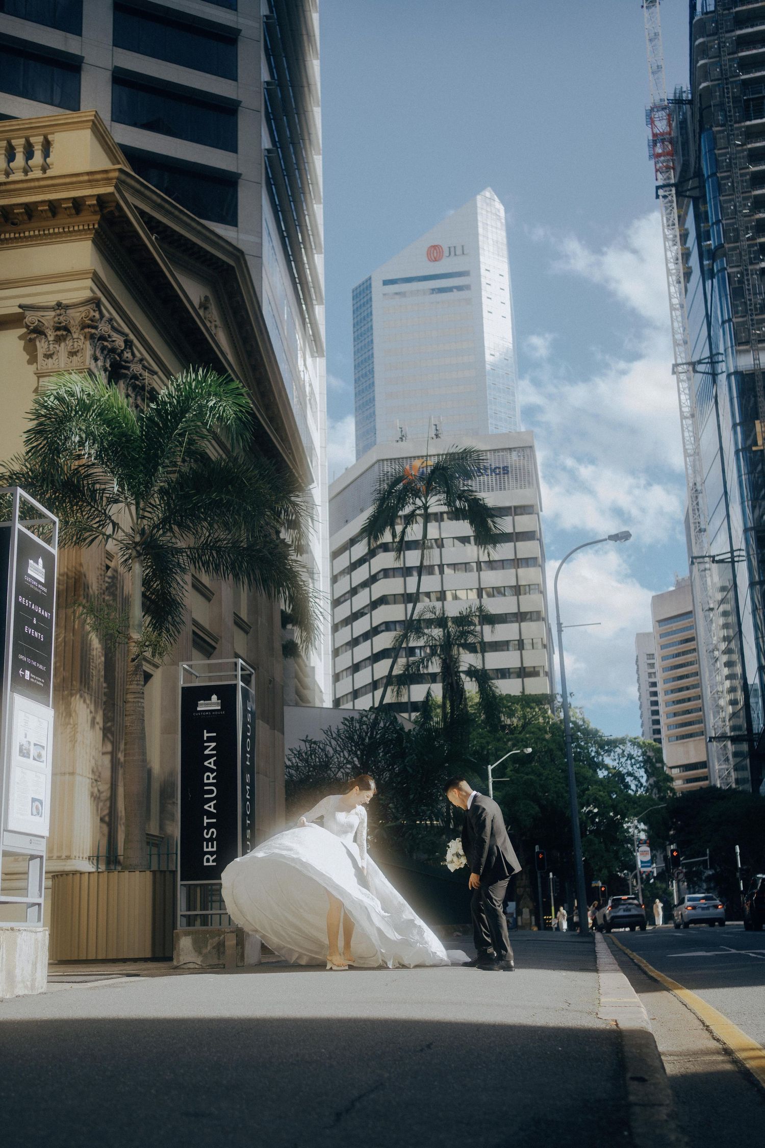 Urban street scene in downtown area with tall buildings, palm trees, and blue sky reflected across five similar views.