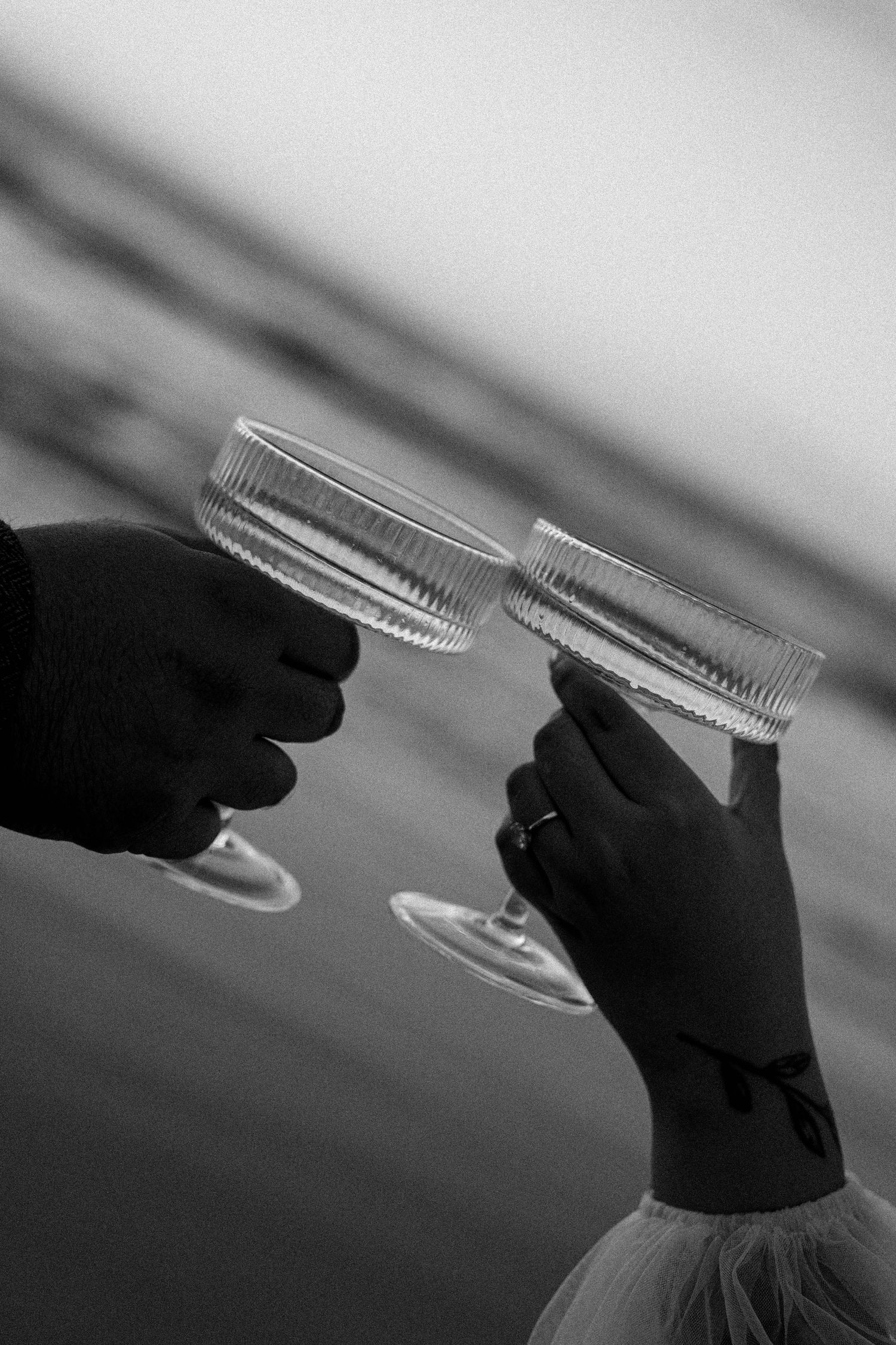 A sequence of black and white photos showing a toothbrush at different angles against a blurred background.
