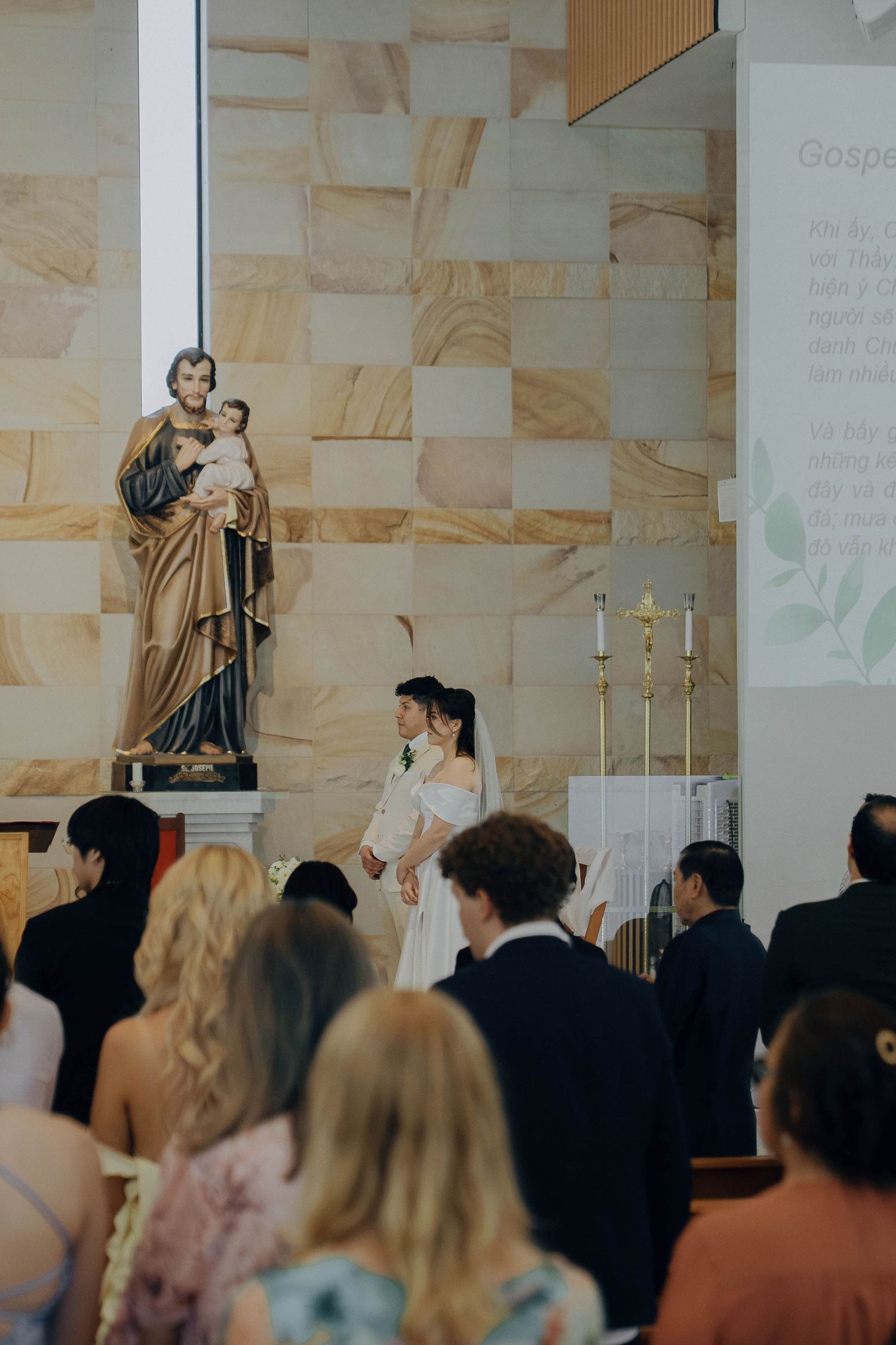 A diverse crowd of people attending a church service or religious gathering in a modern sanctuary.