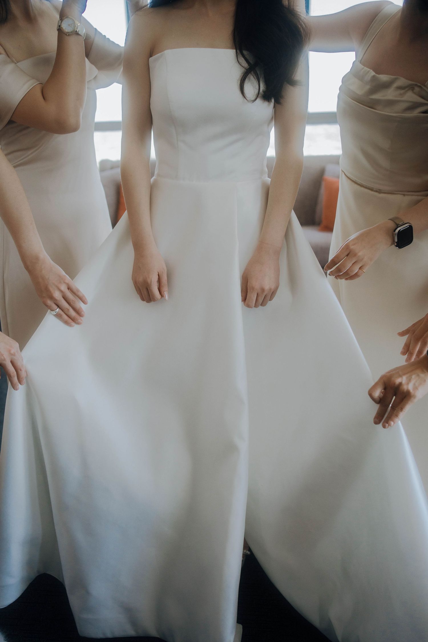 Close-up sequence showing details of a white wedding dress fabric and silhouette.