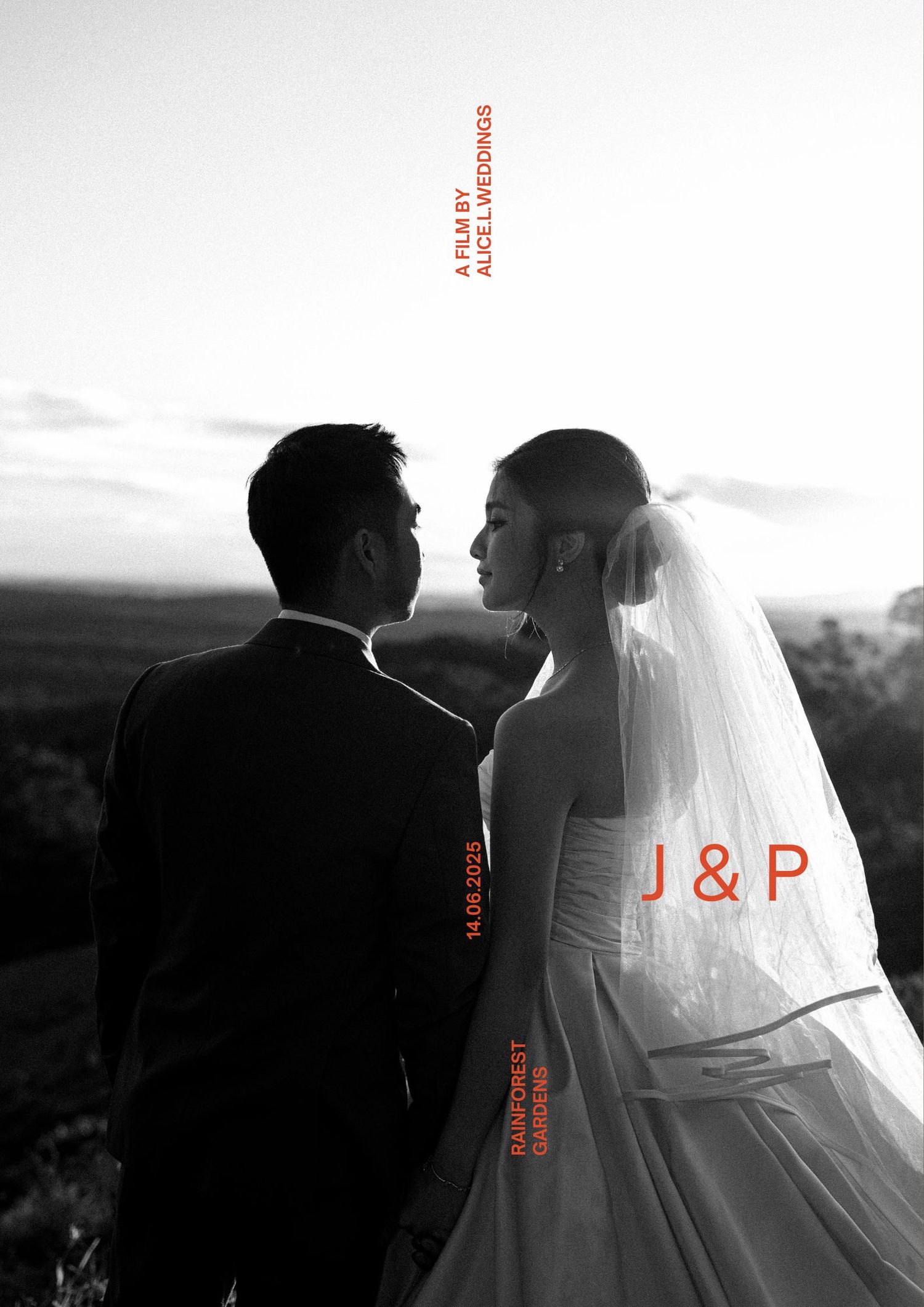 A silhouetted bride and groom pose in black and white against a scenic mountain backdrop at sunset.