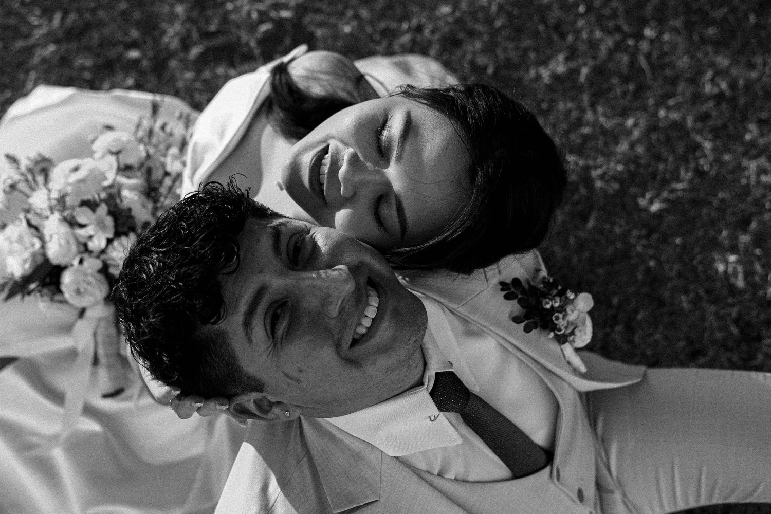A black and white collage of joyful expressions and laughter captured in candid moments.