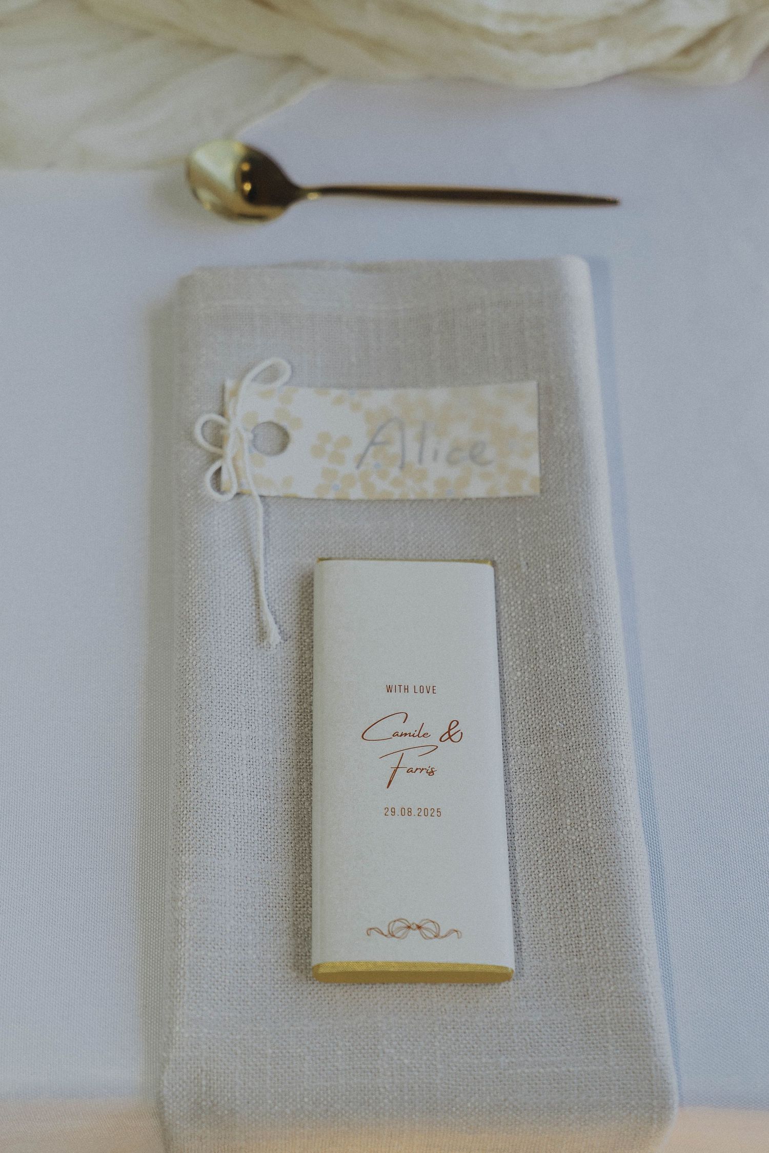 A series of elegant white wedding albums and photo books arranged on a light gray background.