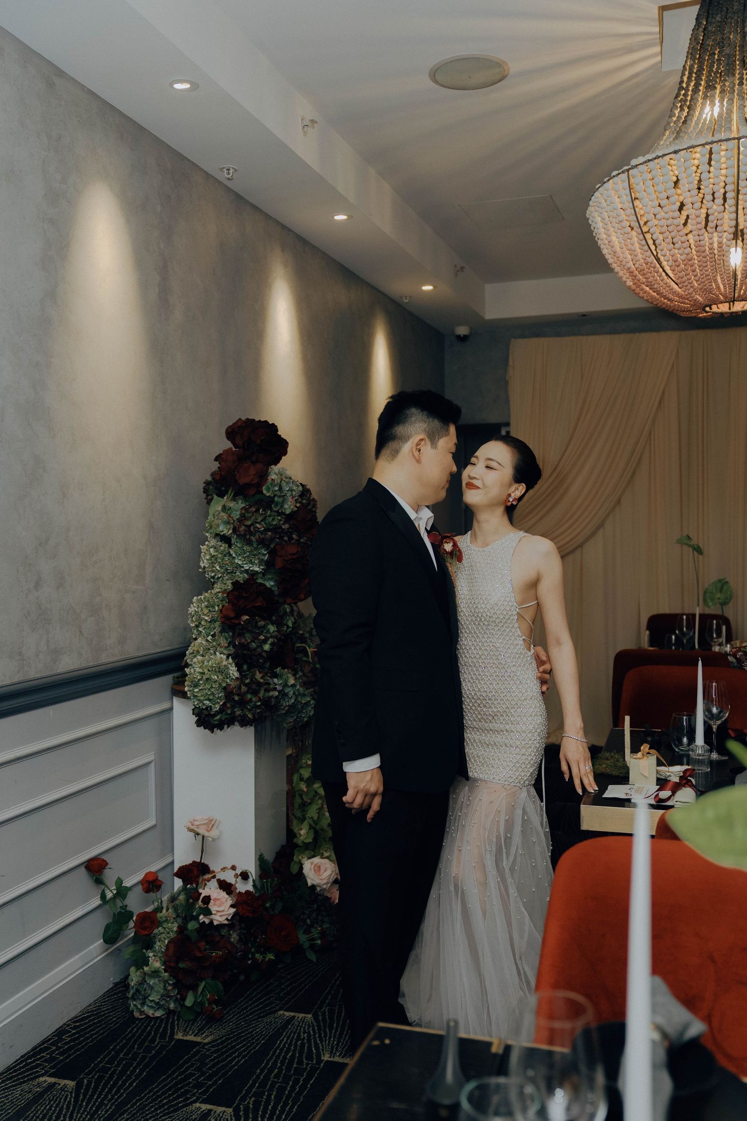 A romantic wedding moment captured in a sequence of candid shots showing the couple in an elegant indoor venue.