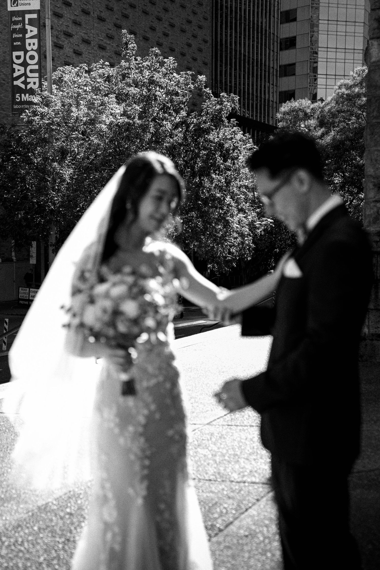 A series of wedding photos showing a couple dancing together in formal attire with flowing white dress and dark suit.