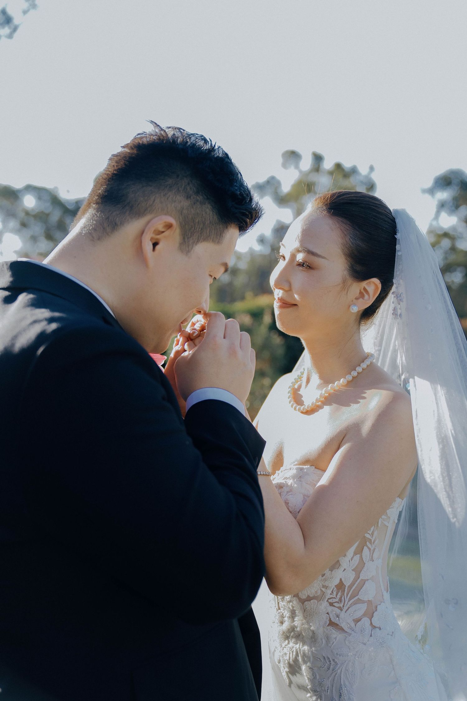 A romantic wedding couple shares intimate moments in a series of close-up photos outdoors.