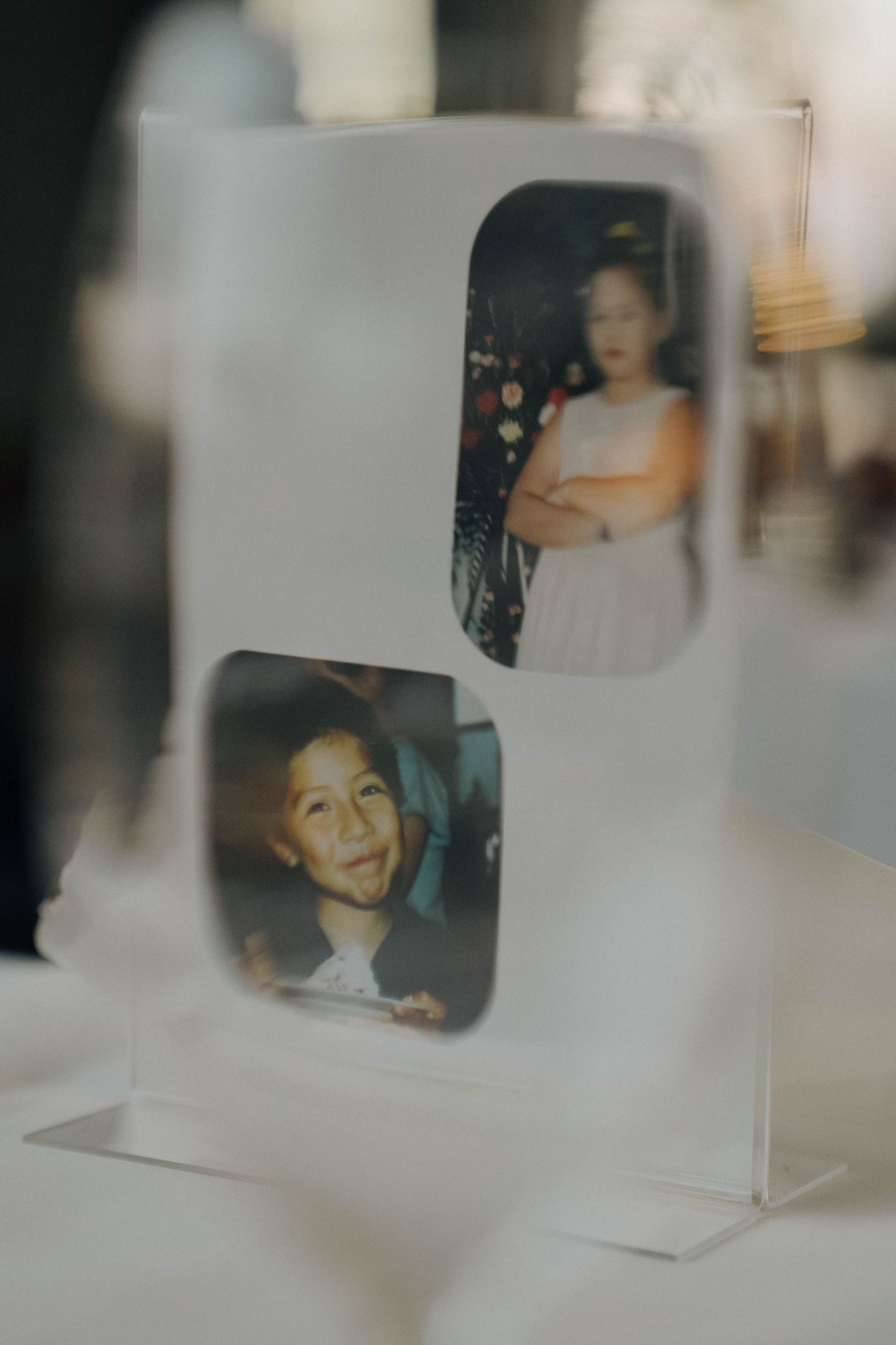 A series of vintage polaroid photos arranged in a row showing blurred and soft-focused nostalgic moments.