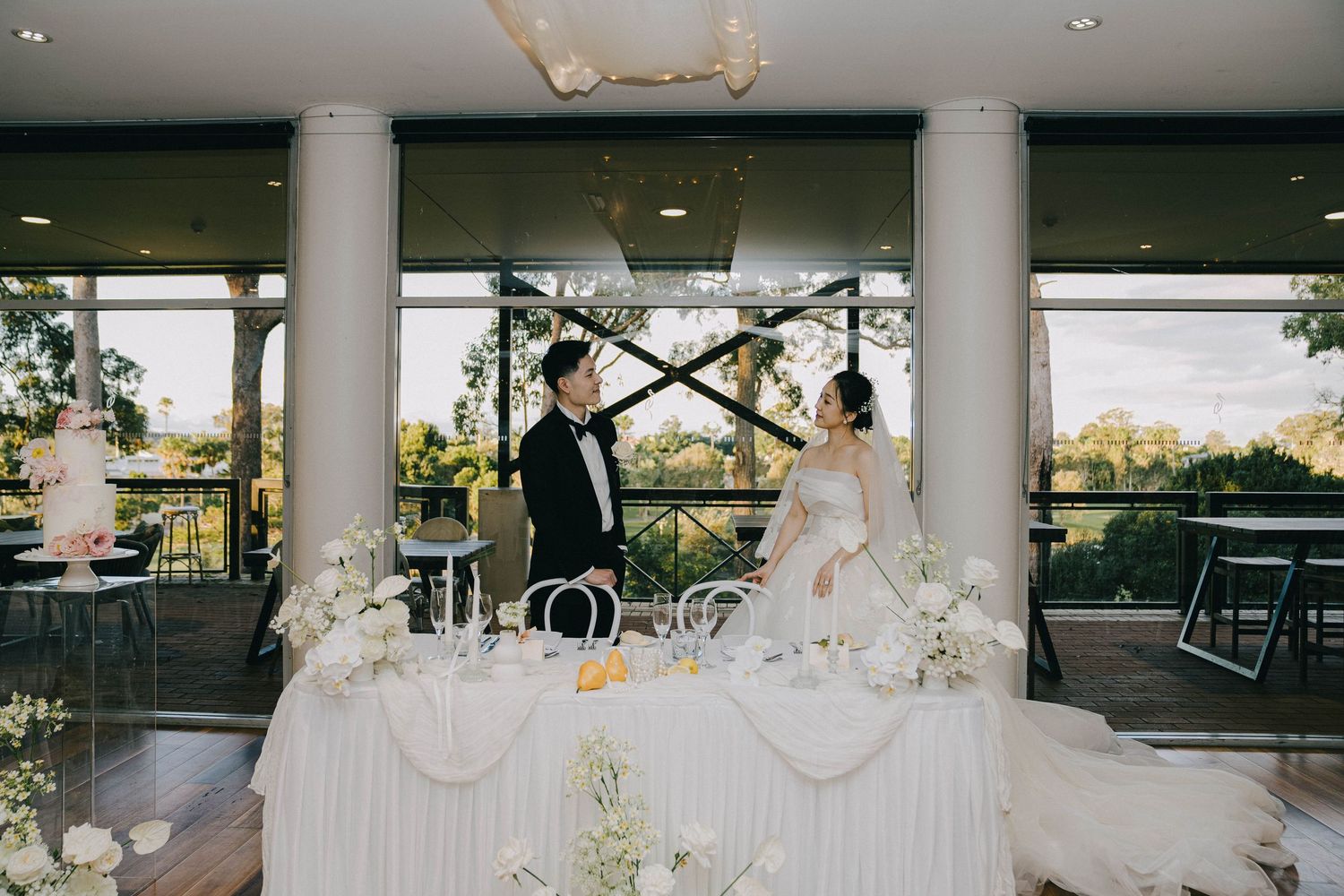 A collage of elegant wedding reception scenes with white columns, floral arrangements, and outdoor dining setups.