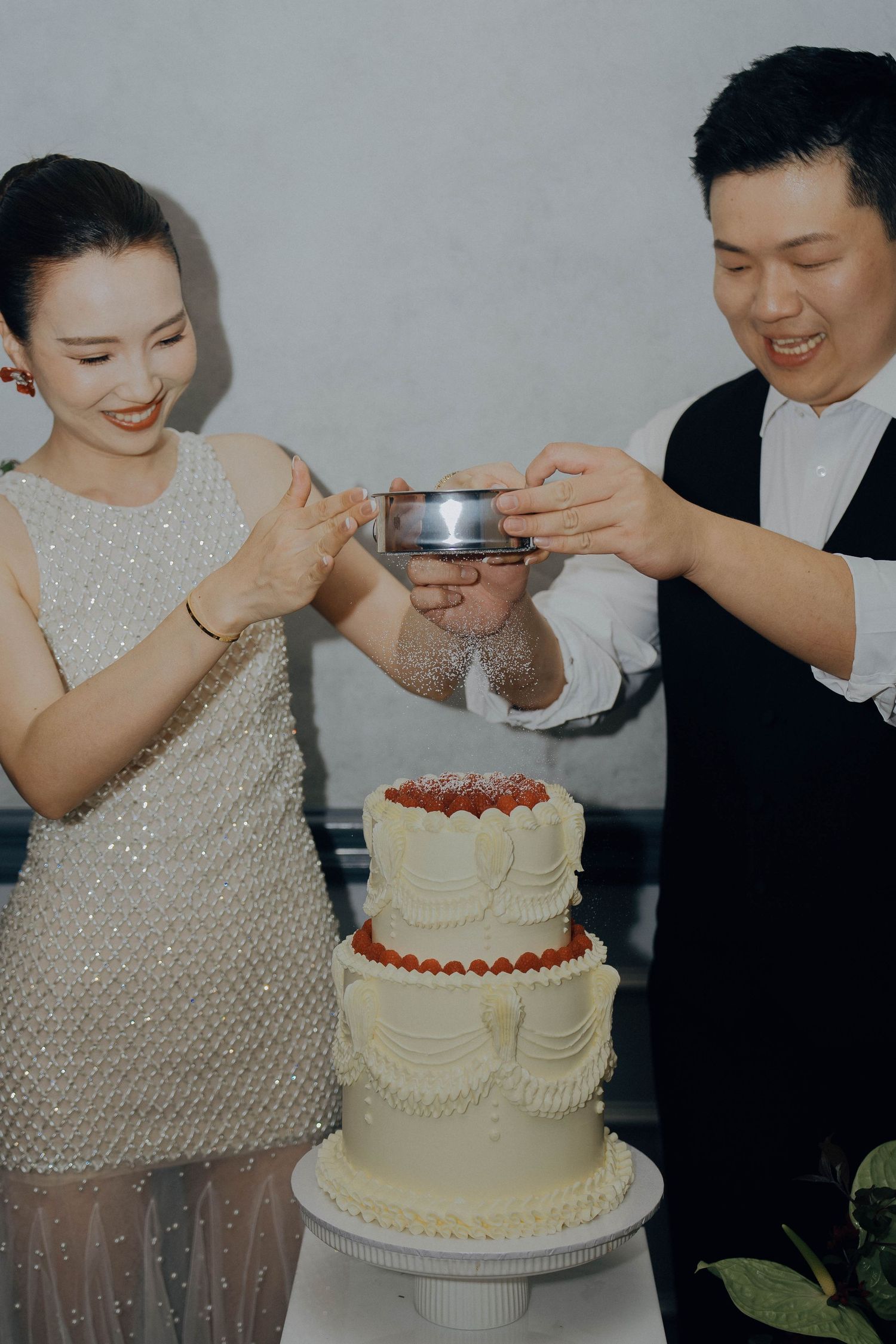 A series of wedding cake photos showing a couple sharing bites of cake during their reception celebration.