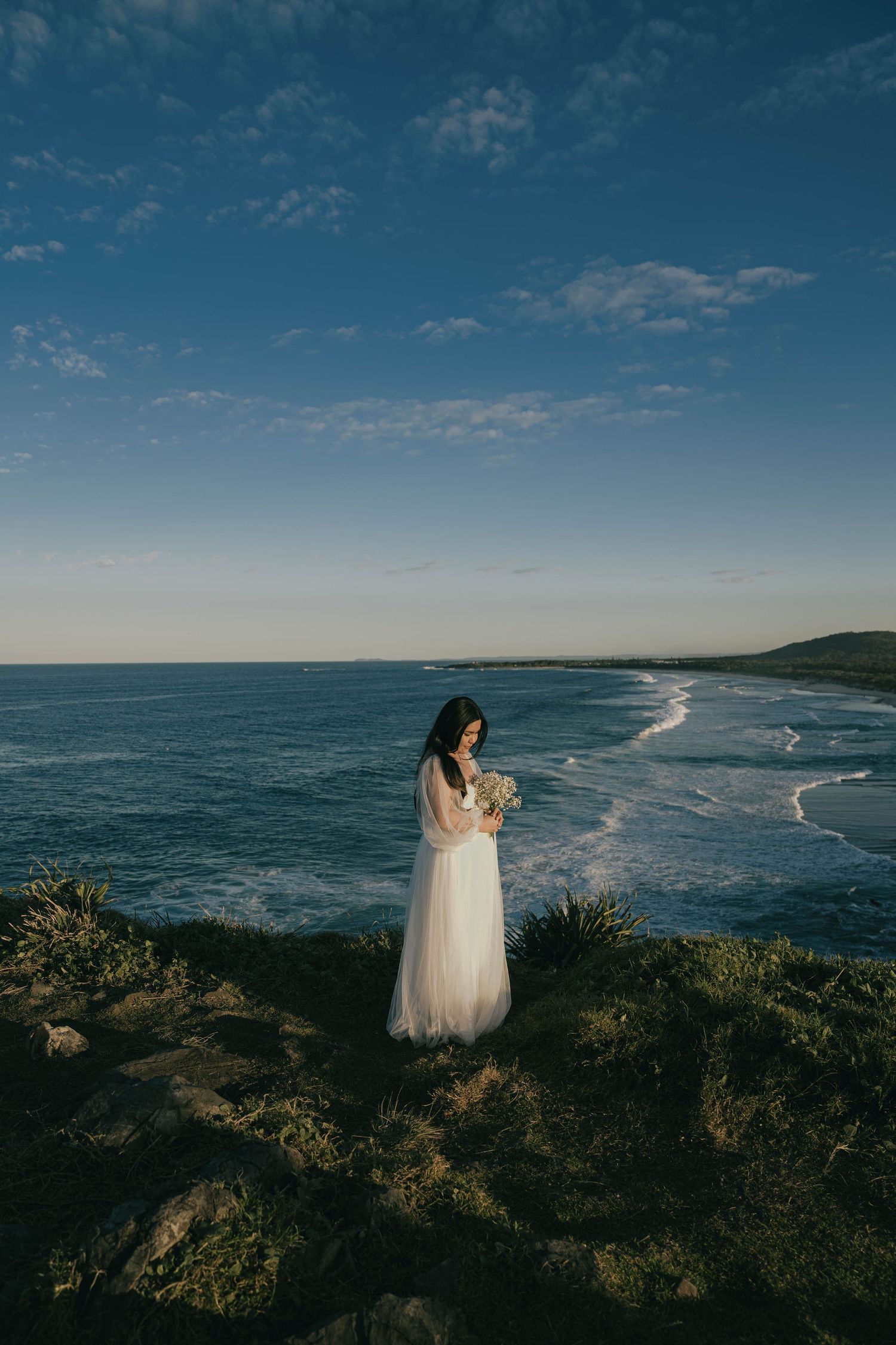 Panoramic coastal landscape series showing a scenic ocean vista with rugged cliffs and blue skies along a dramatic shoreline.