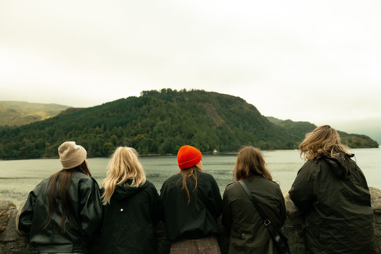 Girls standing in front of Eilean Donan Castle.