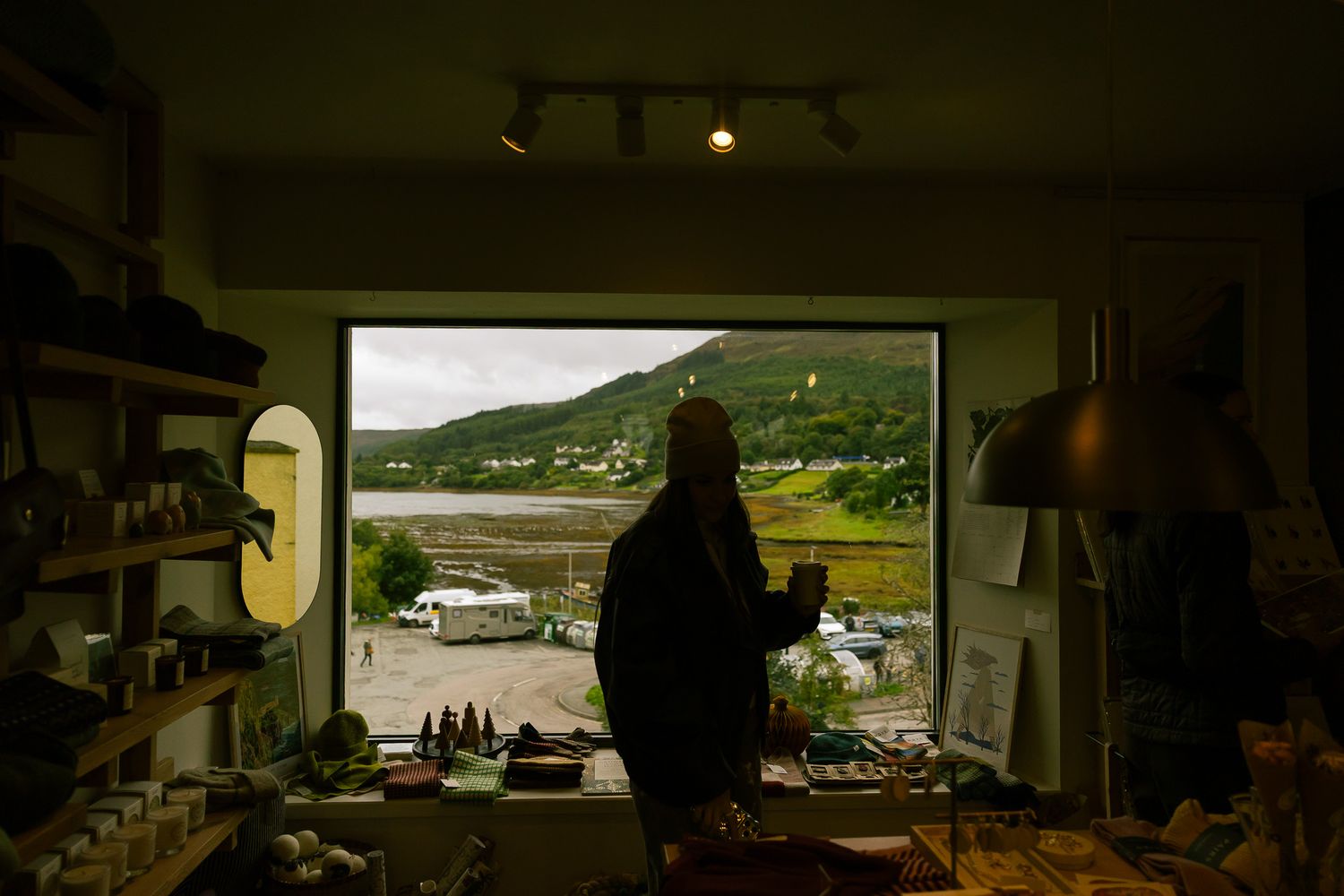 Girl shopping inside store in Portree, Scotland.