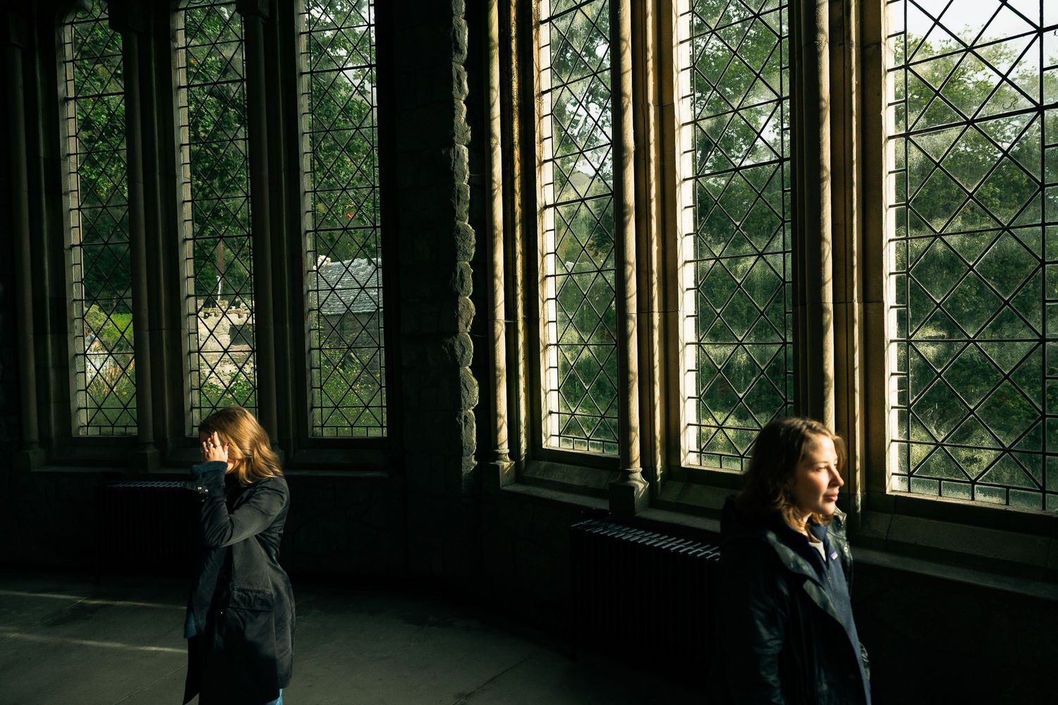 Travelers walking inside St. Conan's Kirk, Scotland.