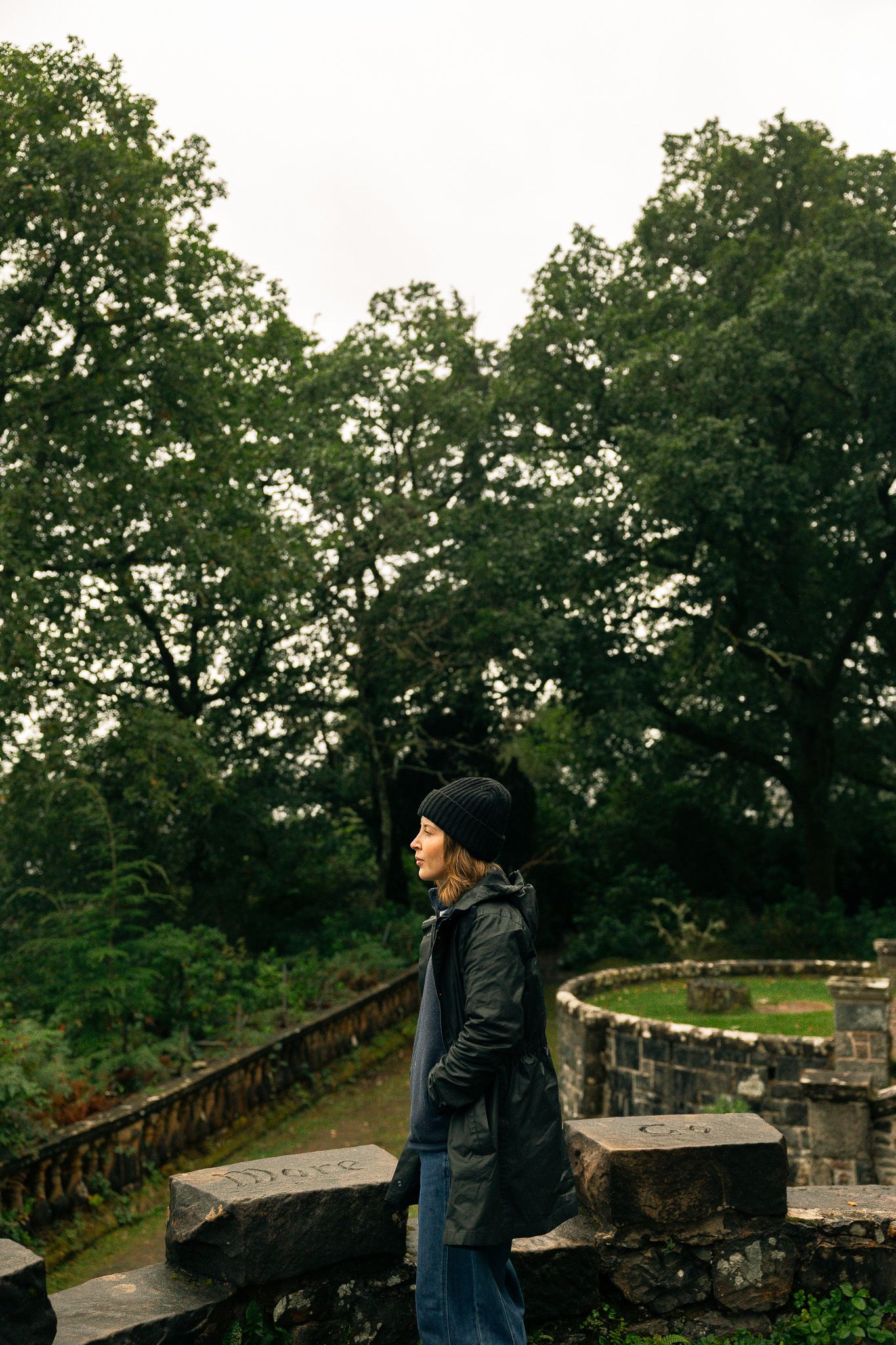 Girl looking at St. Conan's Kirk, Scotland.