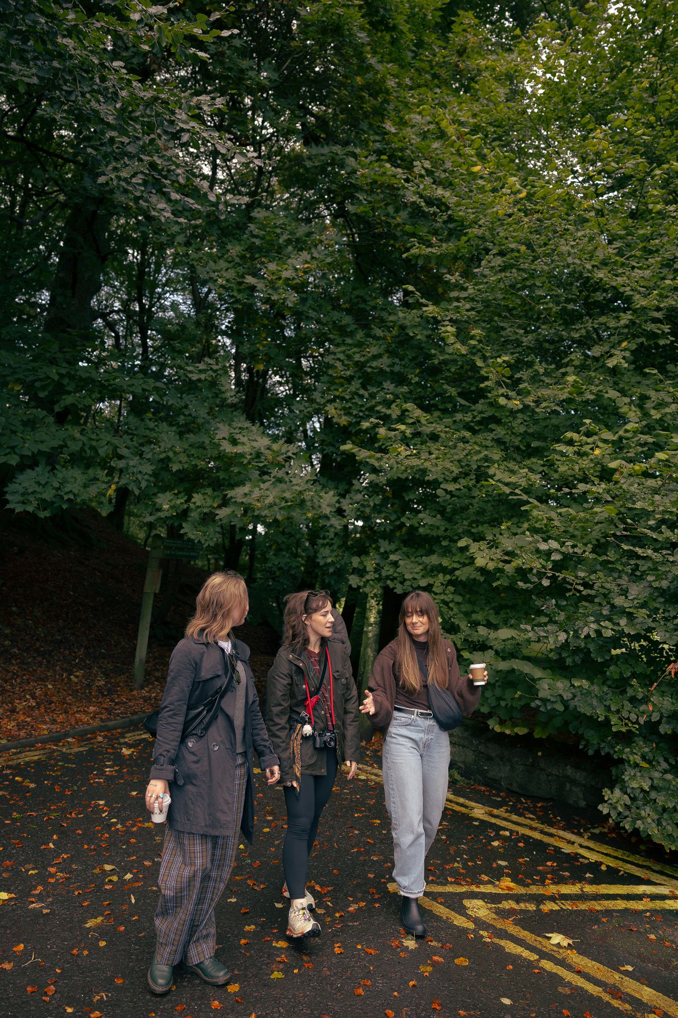 Girls enjoying coffee near car park in Dunkeld, Scotland.