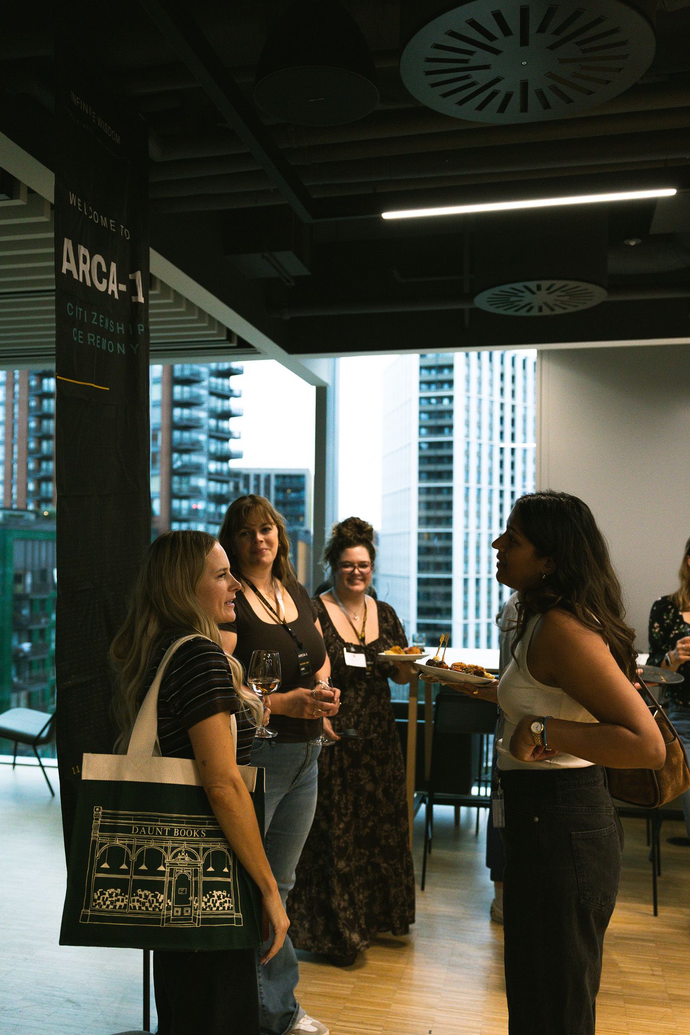 Guests chatting at the Thomas Weaver Arca-1 Infinite Wisdom Release Event at Penguin Random House Headquarters in London, England.