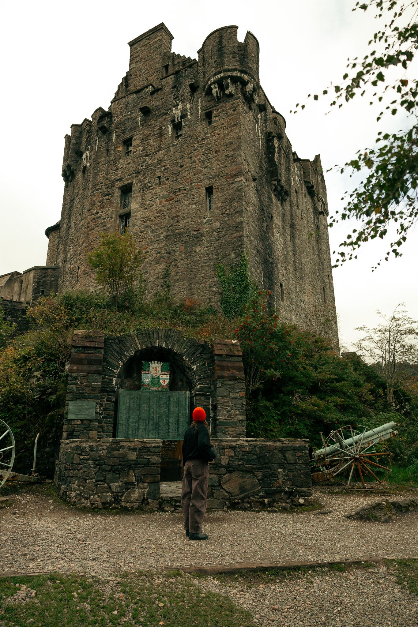 Girl standing in front of Eilean Donan Castle.