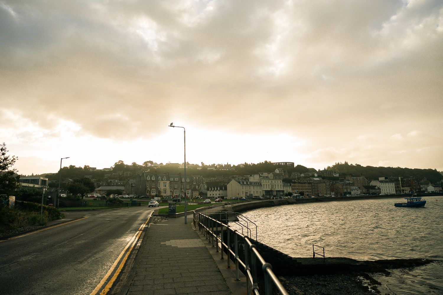 Waterfront walk at sunrise in Oban, Scotland.