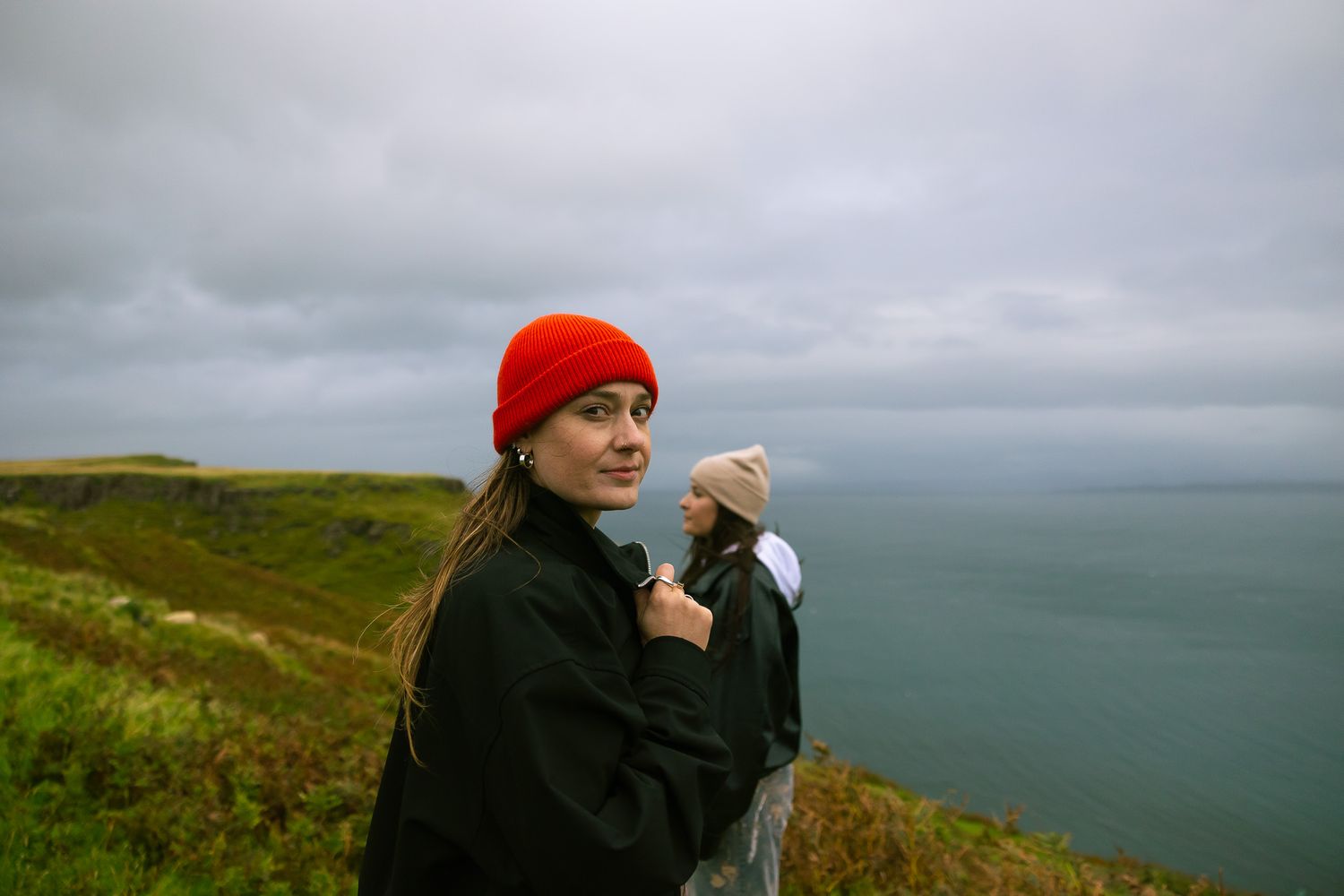 Editorial poses at Old Man of Storr, Scotland.