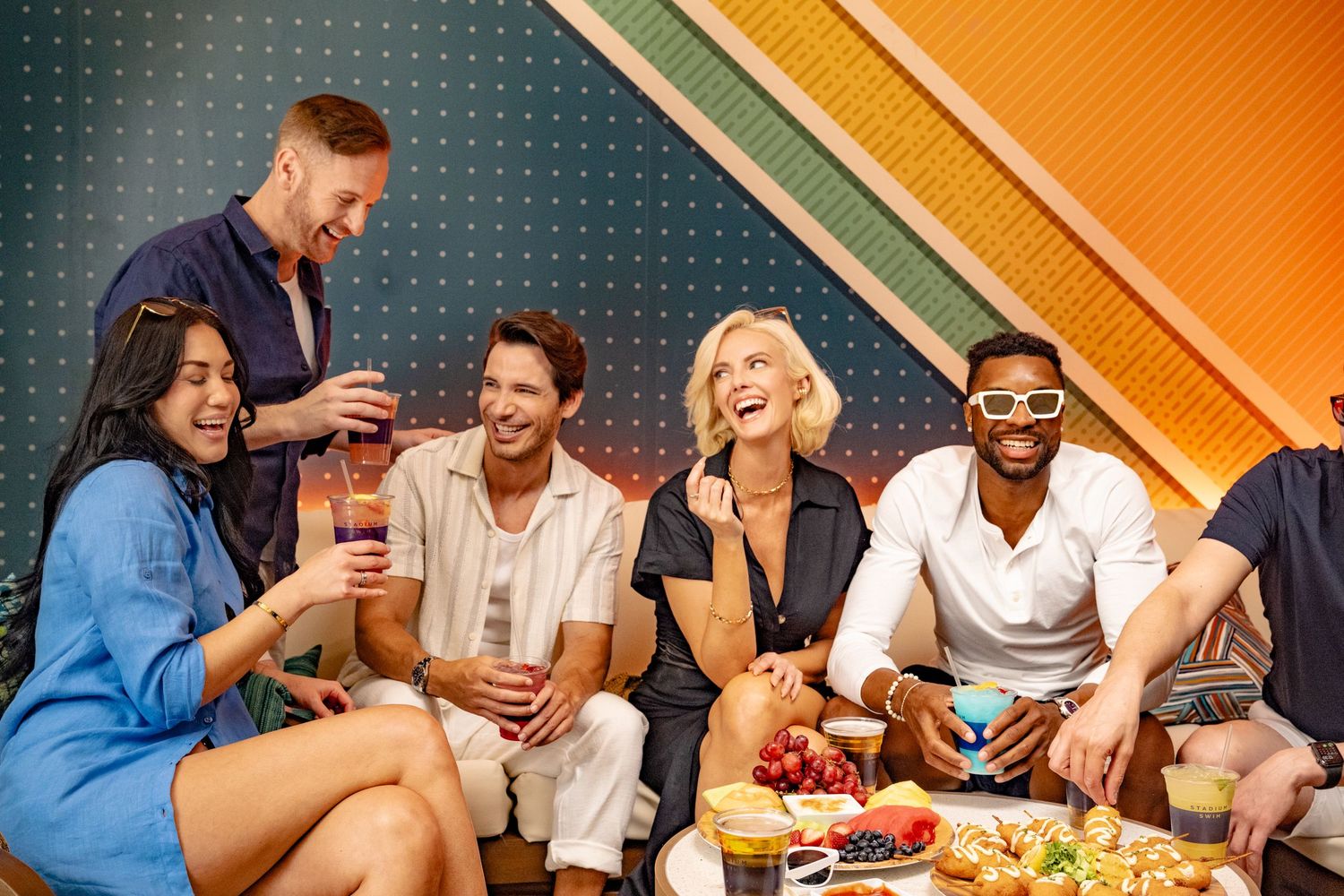 Guests cheering with beer during a lively dining experience in Las Vegas