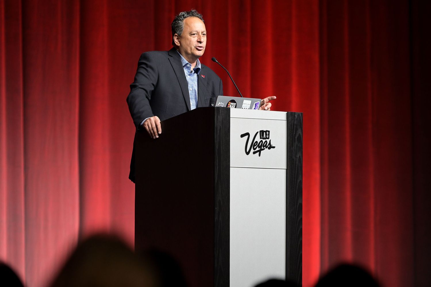 Professional speaker presenting to attendees at a Las Vegas convention