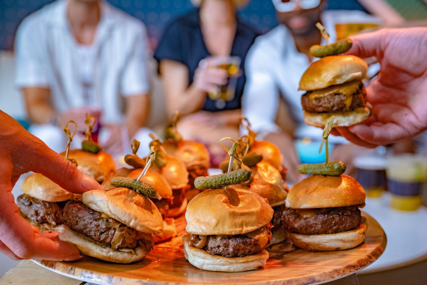 Gourmet burgers being served during a restaurant dining experience