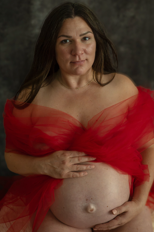 maternity boudoir photo of a women that is 30 weeks pregnant