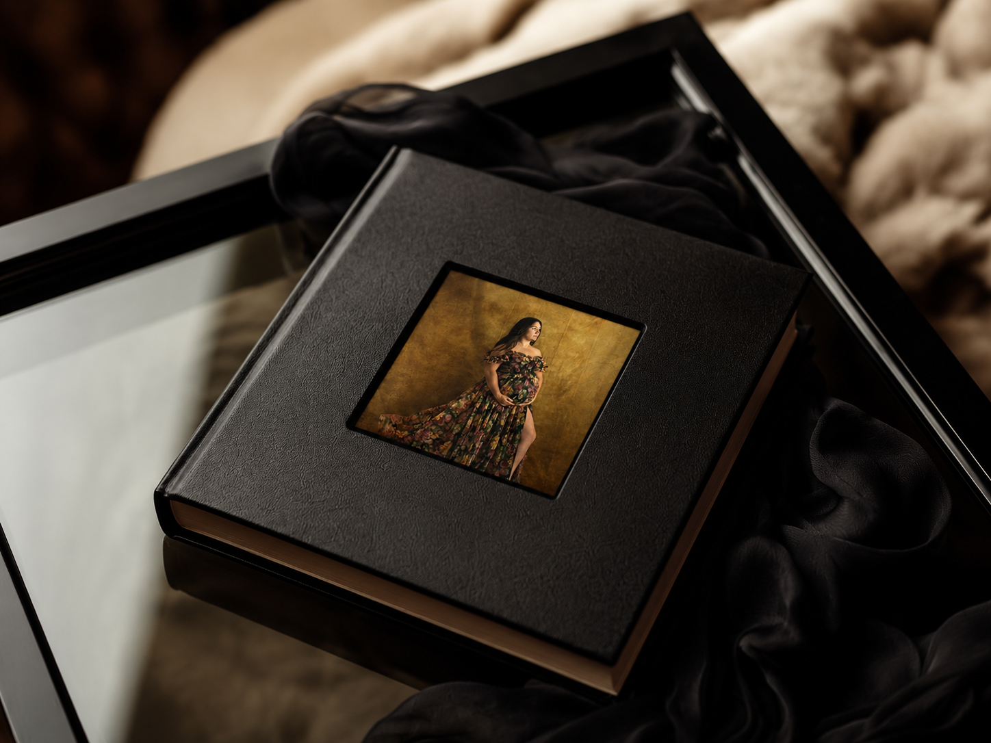 professional coffee table album with a cameo cover of a pregnant woman in a fine art maternity photo